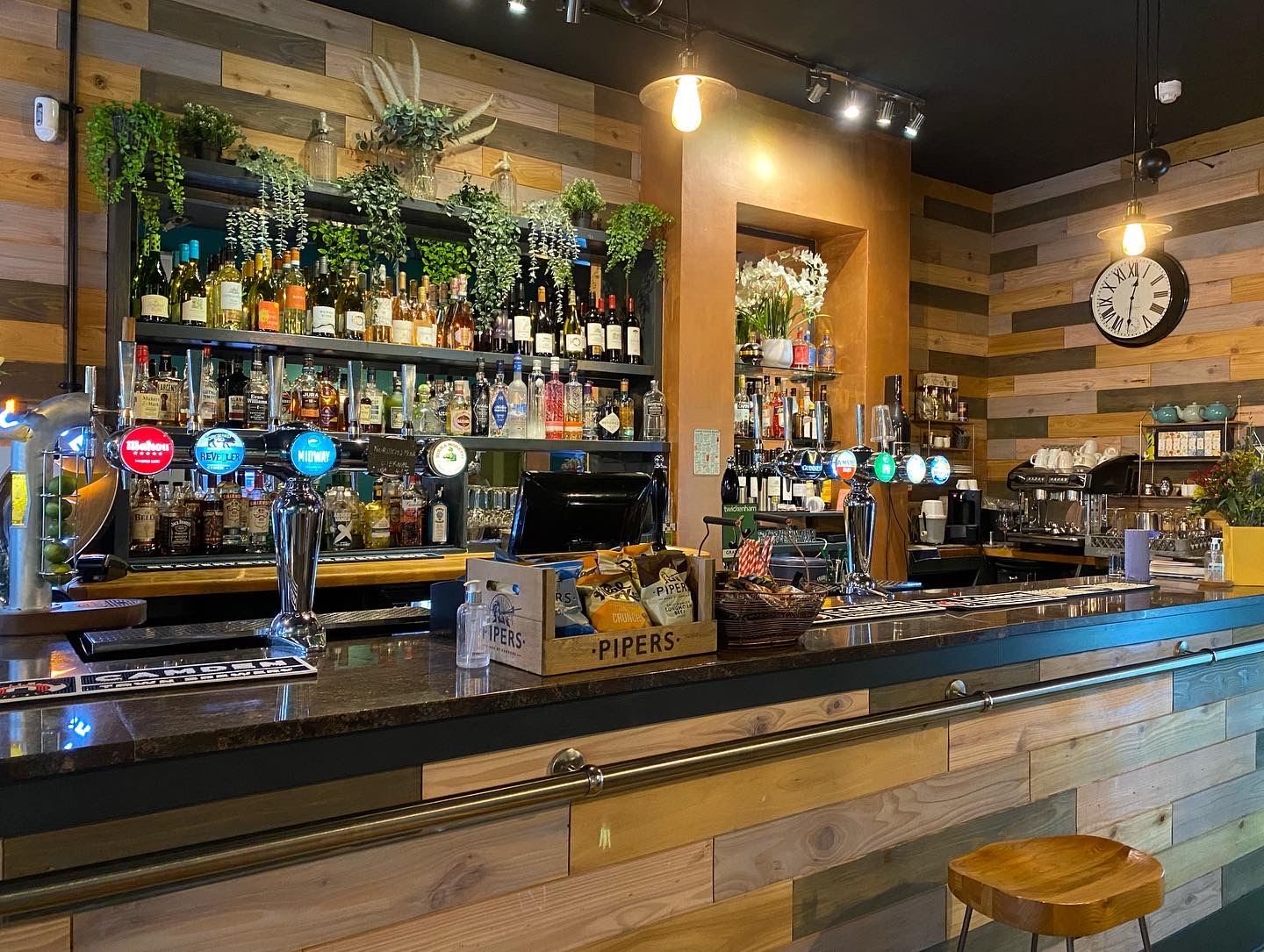 Warm bar area with wooden accents, ideal for networking events and gatherings.