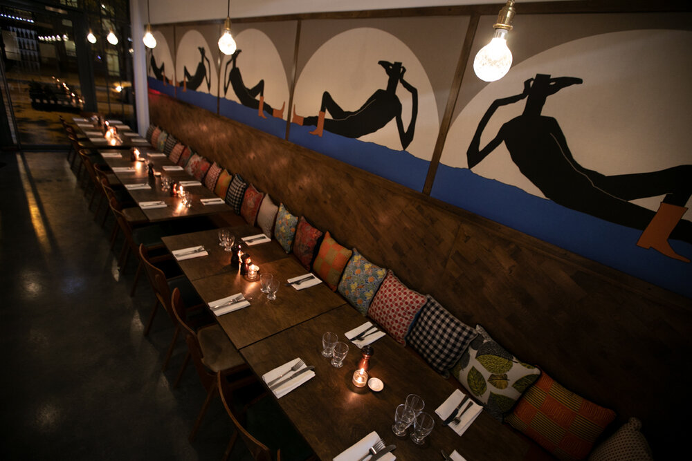 Stylish Lardo restaurant dining space with elegant table, ideal for corporate dinners and gatherings.