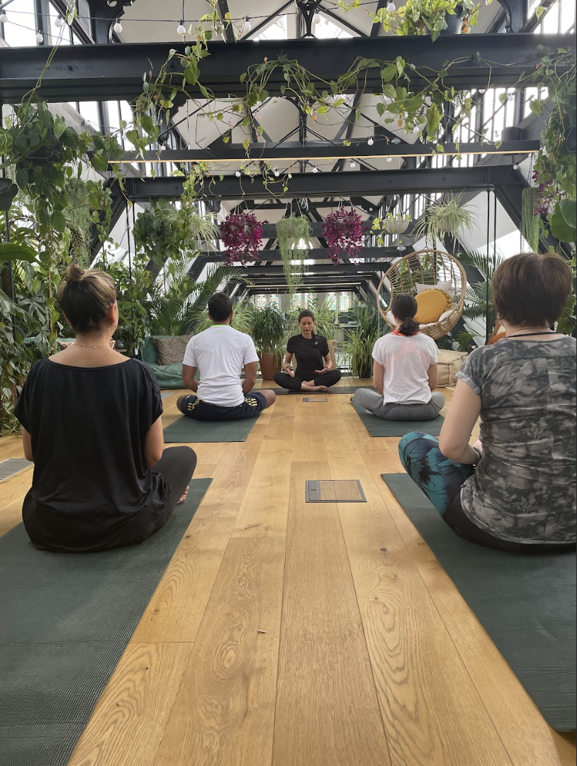 Serene wellness session in lush Hanging Garden, perfect for corporate retreats and team-building.