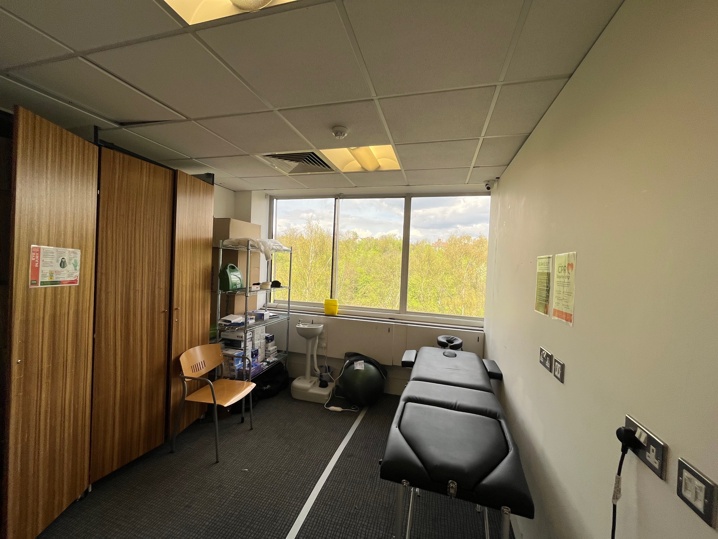 Wellness room with treatment table for health workshops in London rangers.