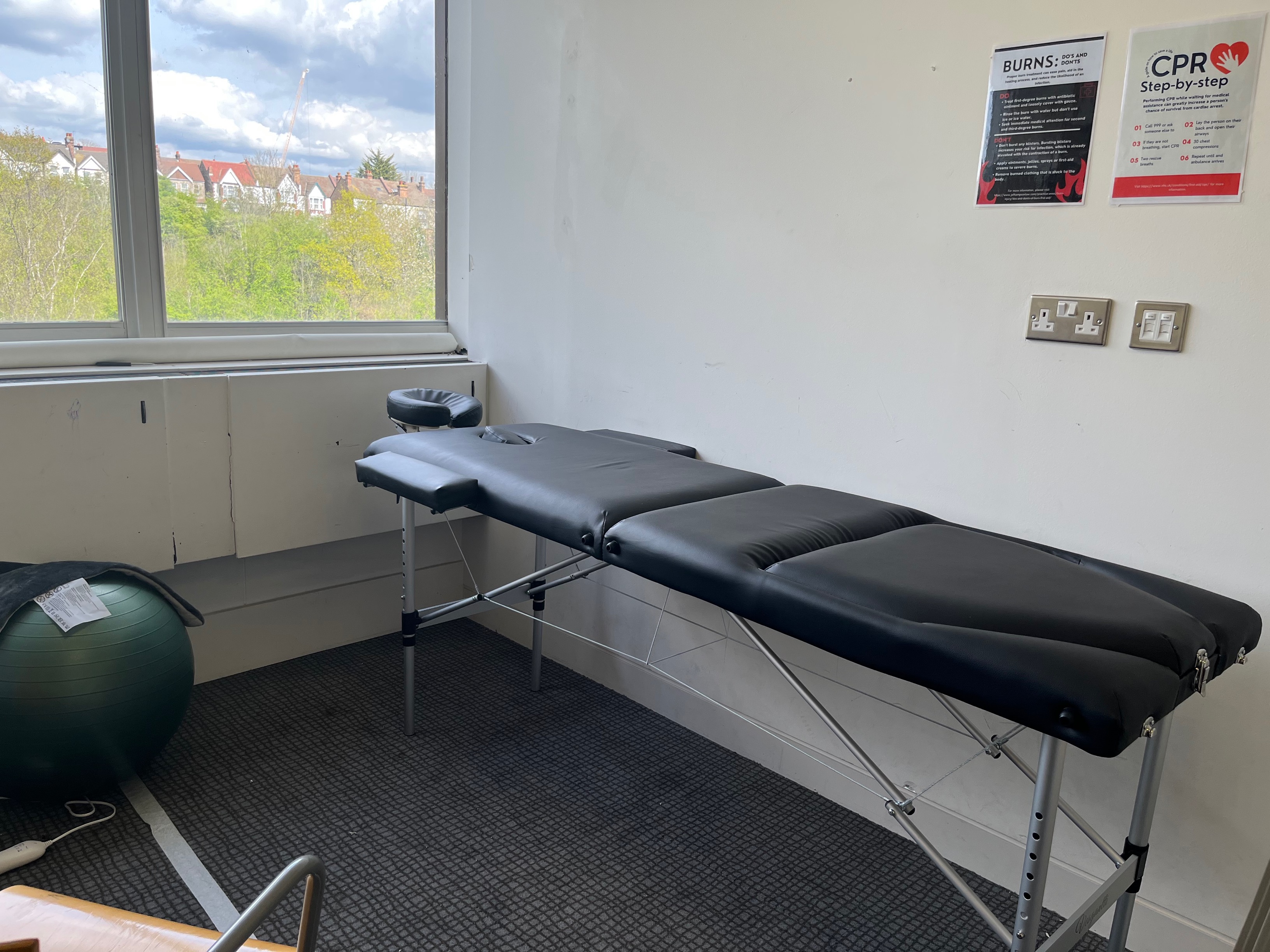 Wellness treatment room with massage table for corporate retreats and relaxation sessions.