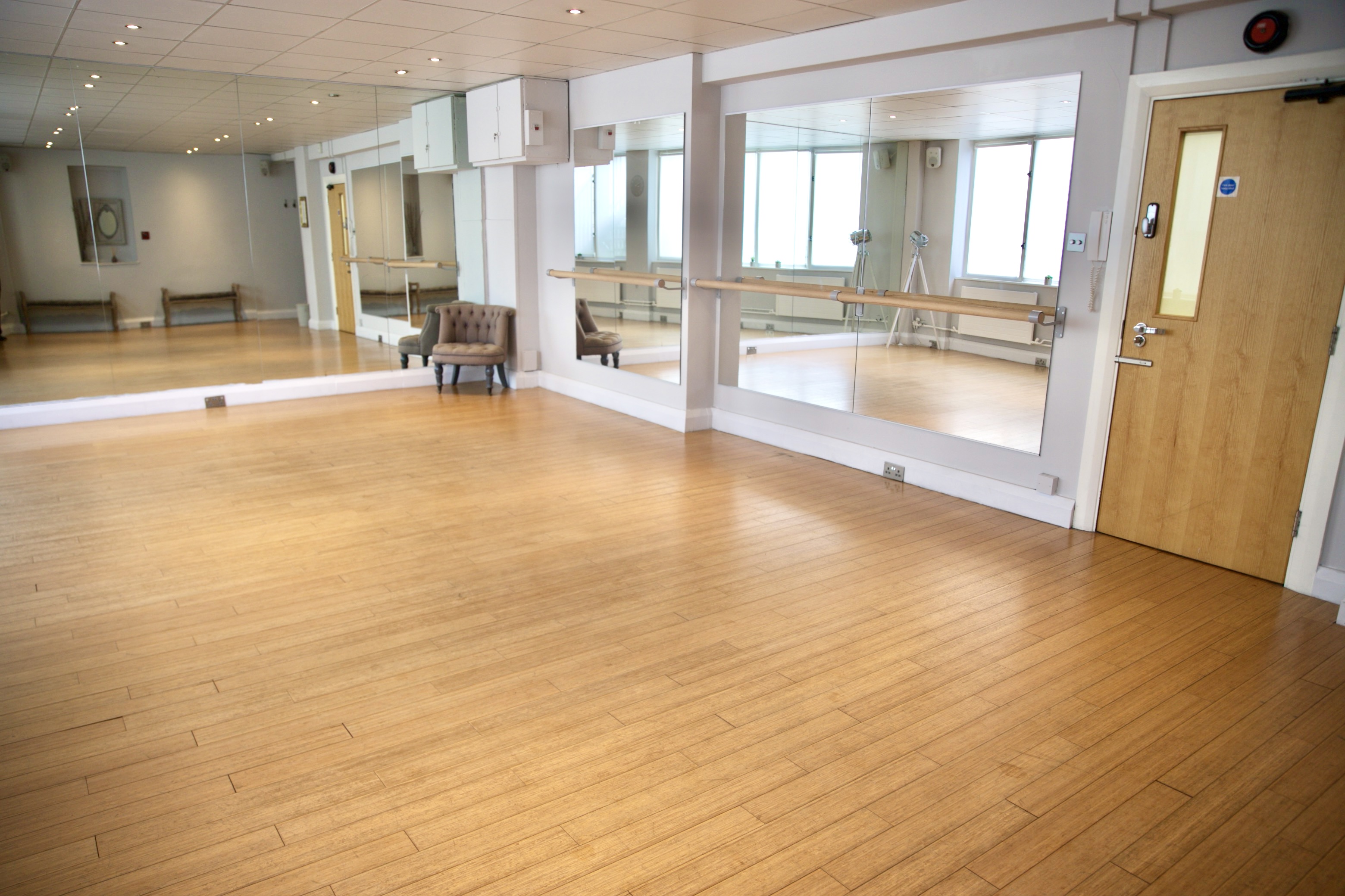 Versatile event space with polished wooden floors for dance classes and workshops.