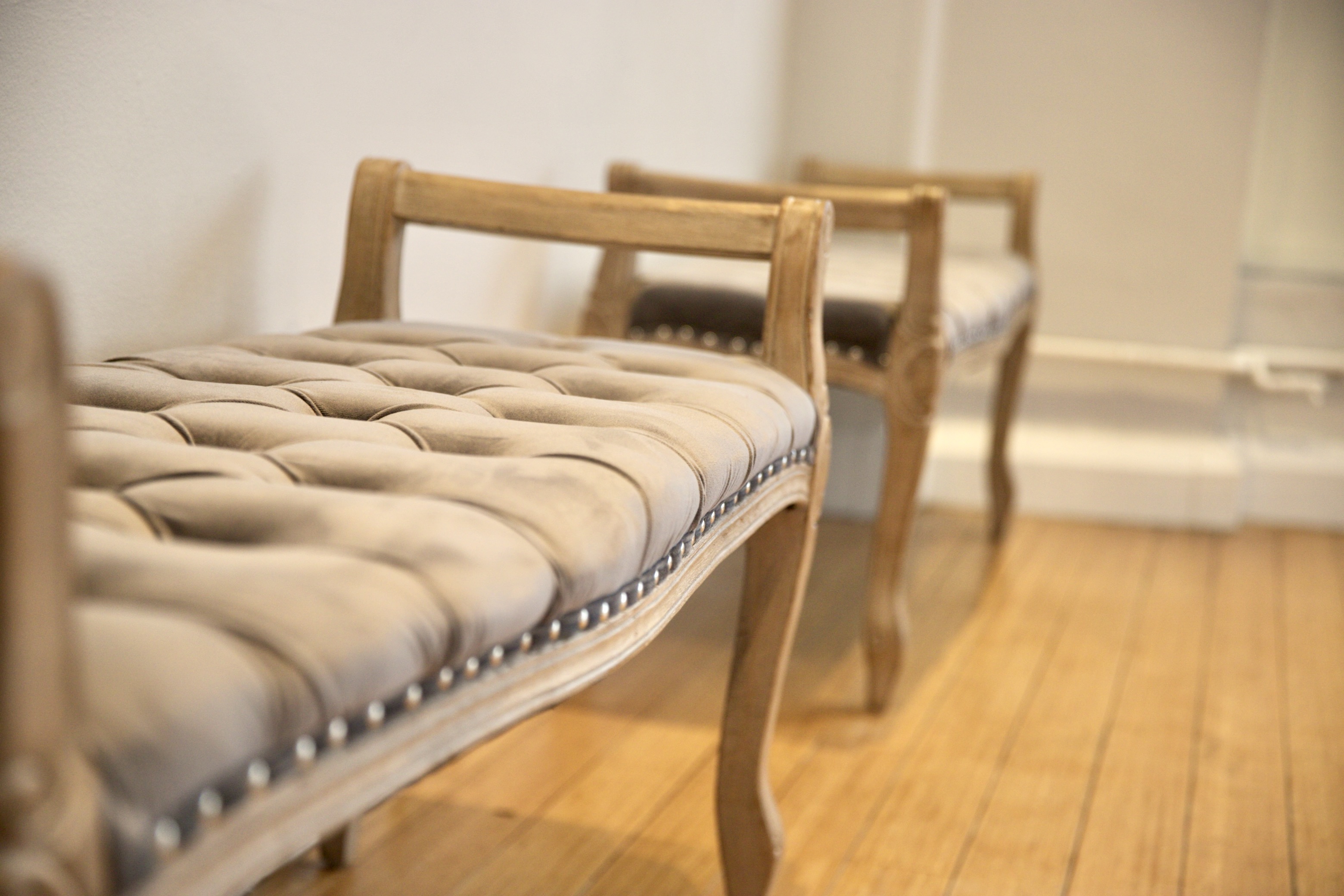 Elegant tufted benches for stylish seating in event spaces and meetings.