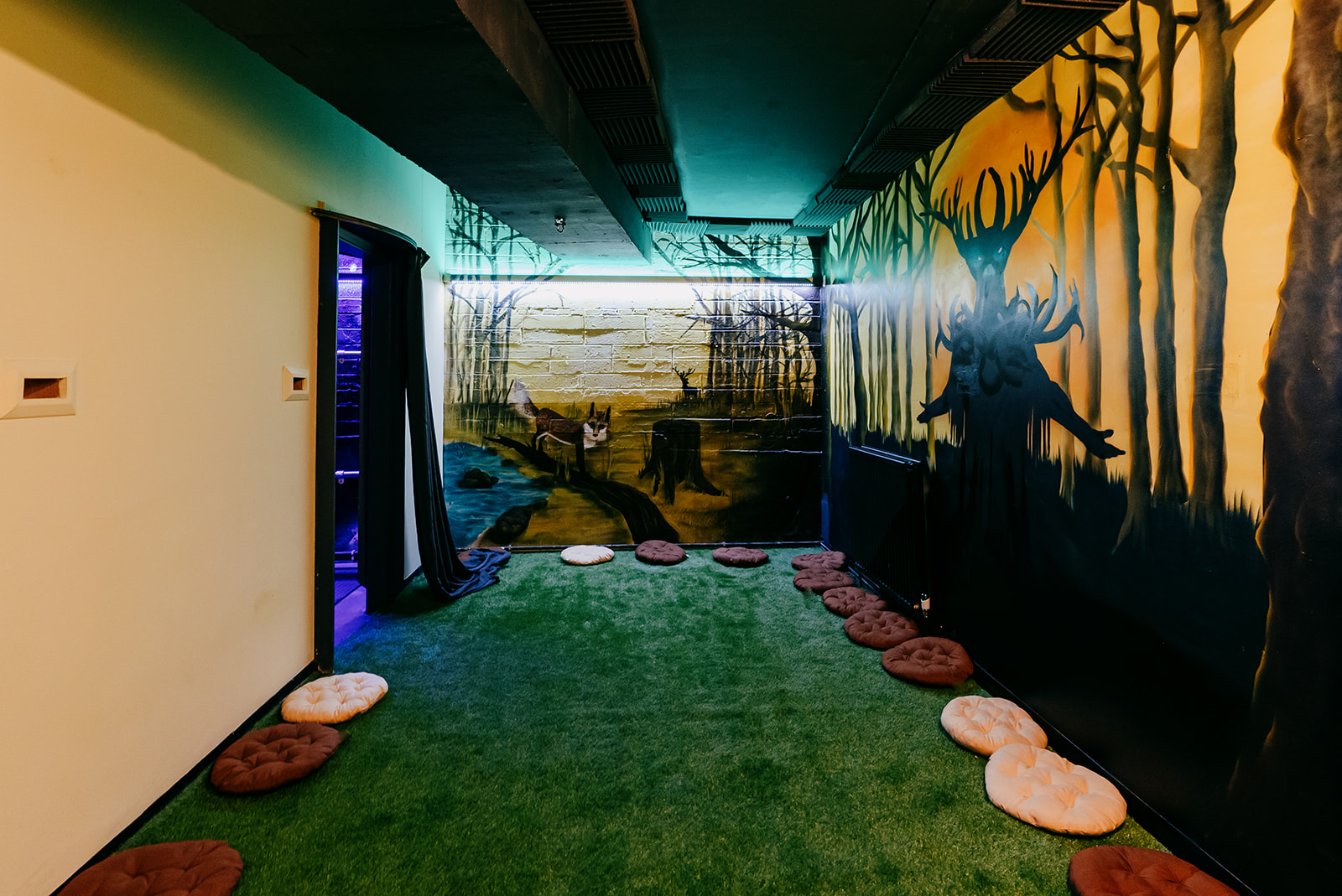 Creative corridor at Blake Studios with mural, ideal for events and networking.