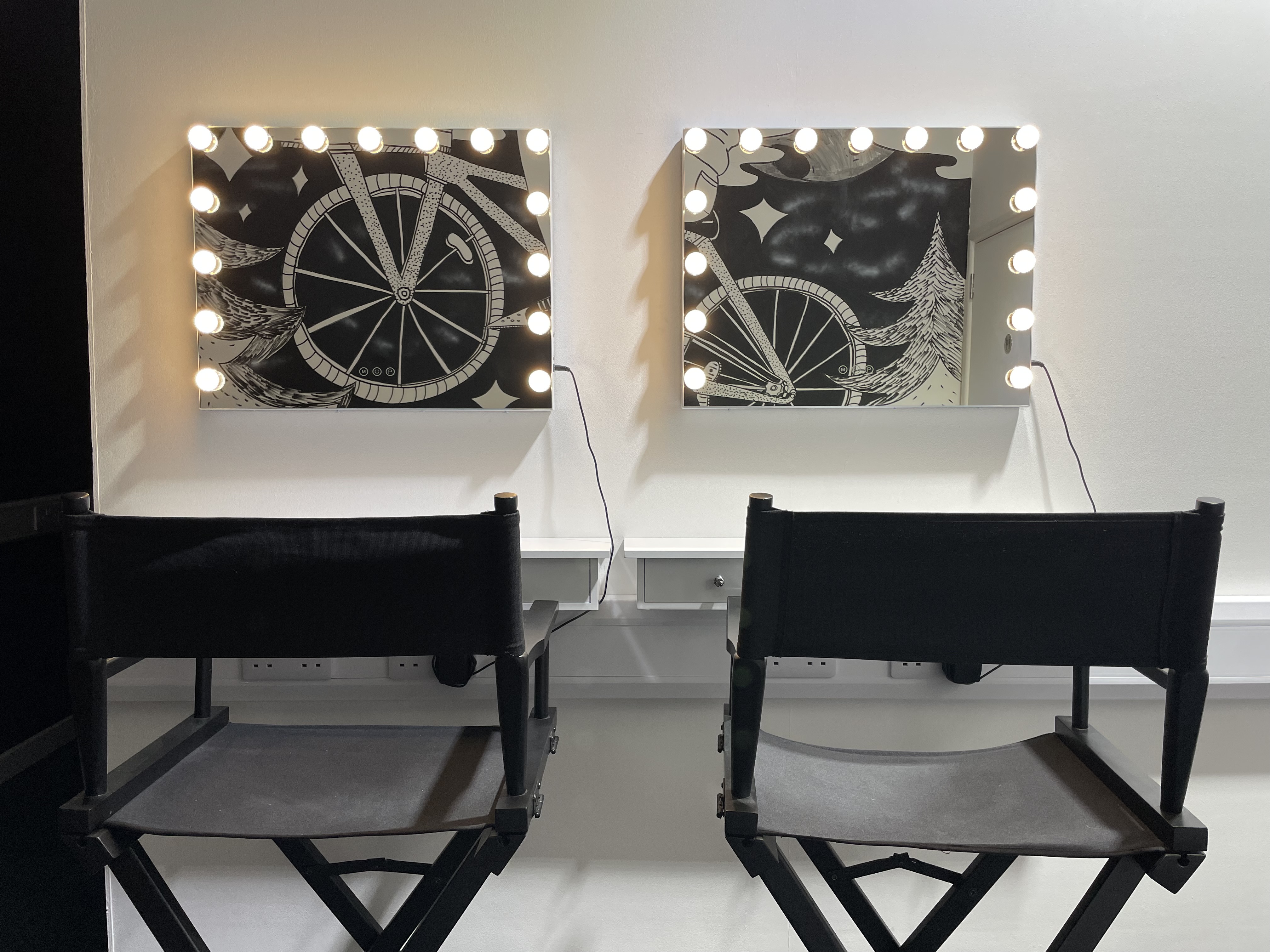 Stylish backstage area with vanity mirrors for events at Summer Isle Studios.