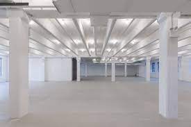 Spacious, well-lit event venue with high ceilings for conferences and gatherings.