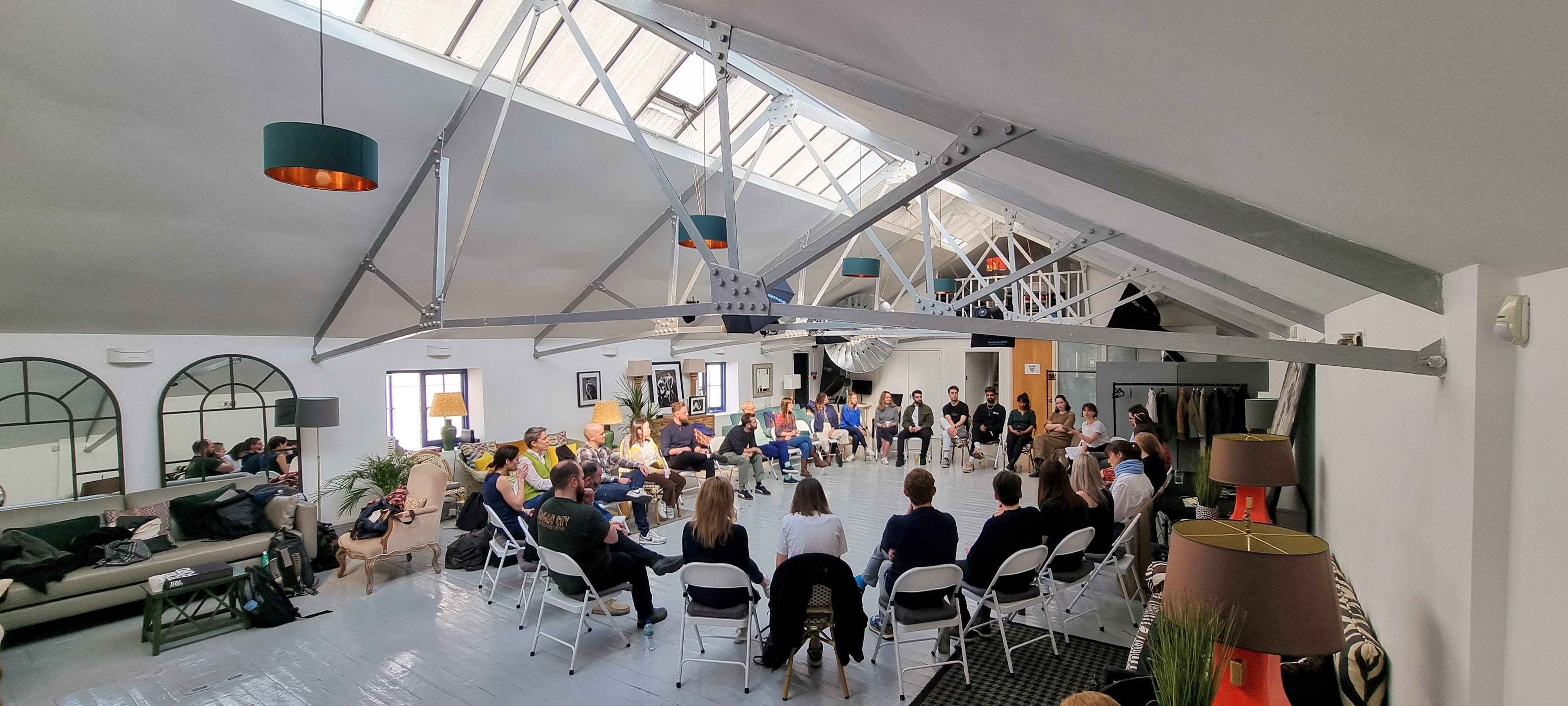 L'Atelier meeting space in London with circular seating for workshops and collaboration.