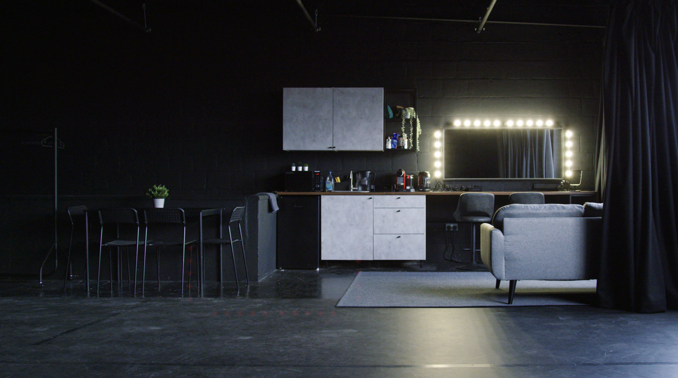 Modern event space in Klatch Studio with kitchenette and stylish vanity area.