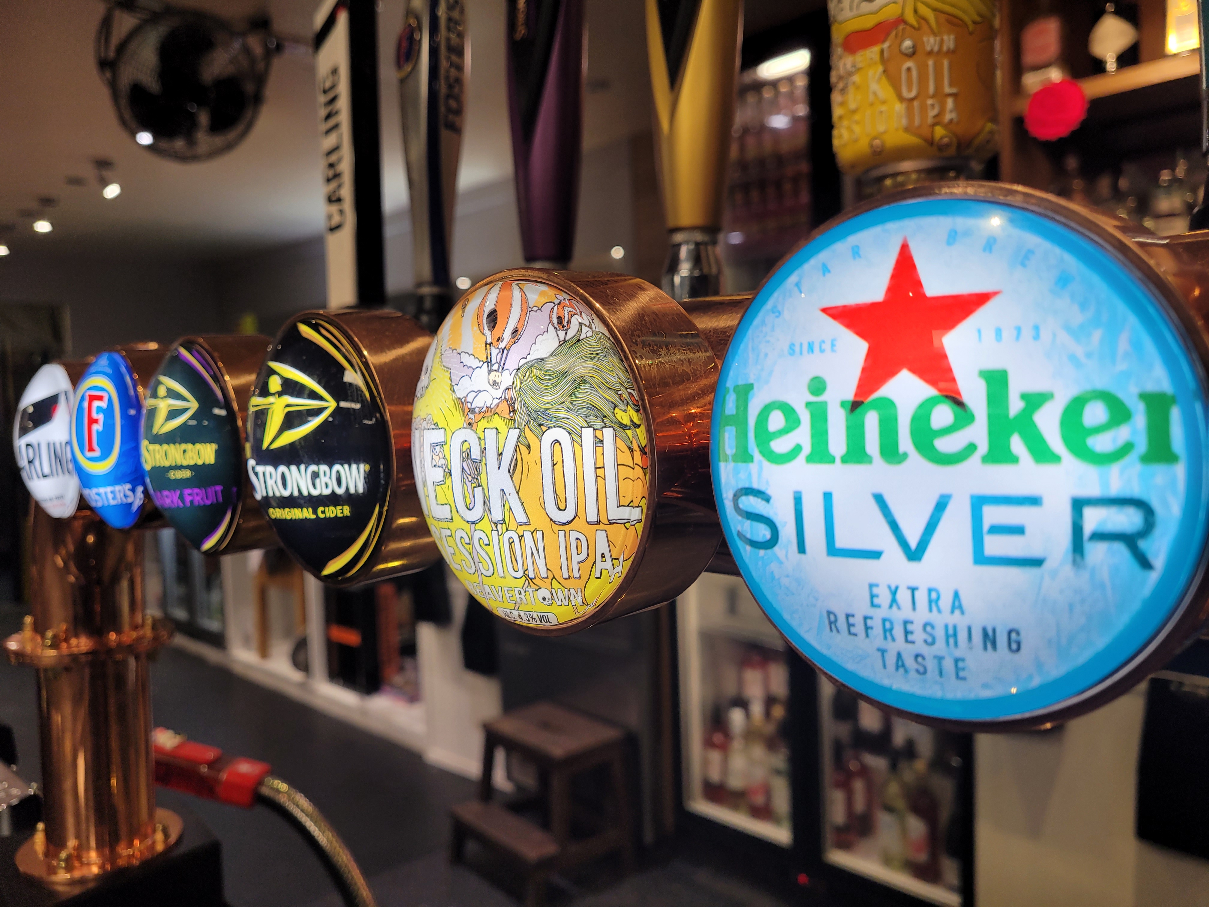 Vibrant beer taps at The New Roxy for events and networking opportunities.