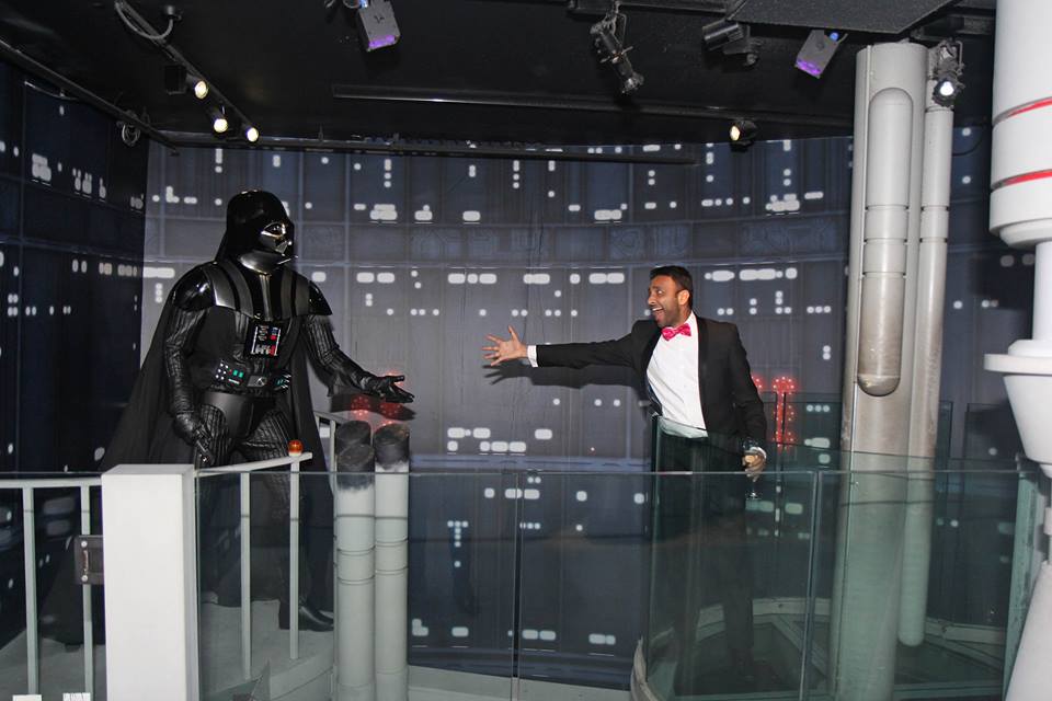 Darth Vader interacts with a guest at themed event in Madame Tussauds.