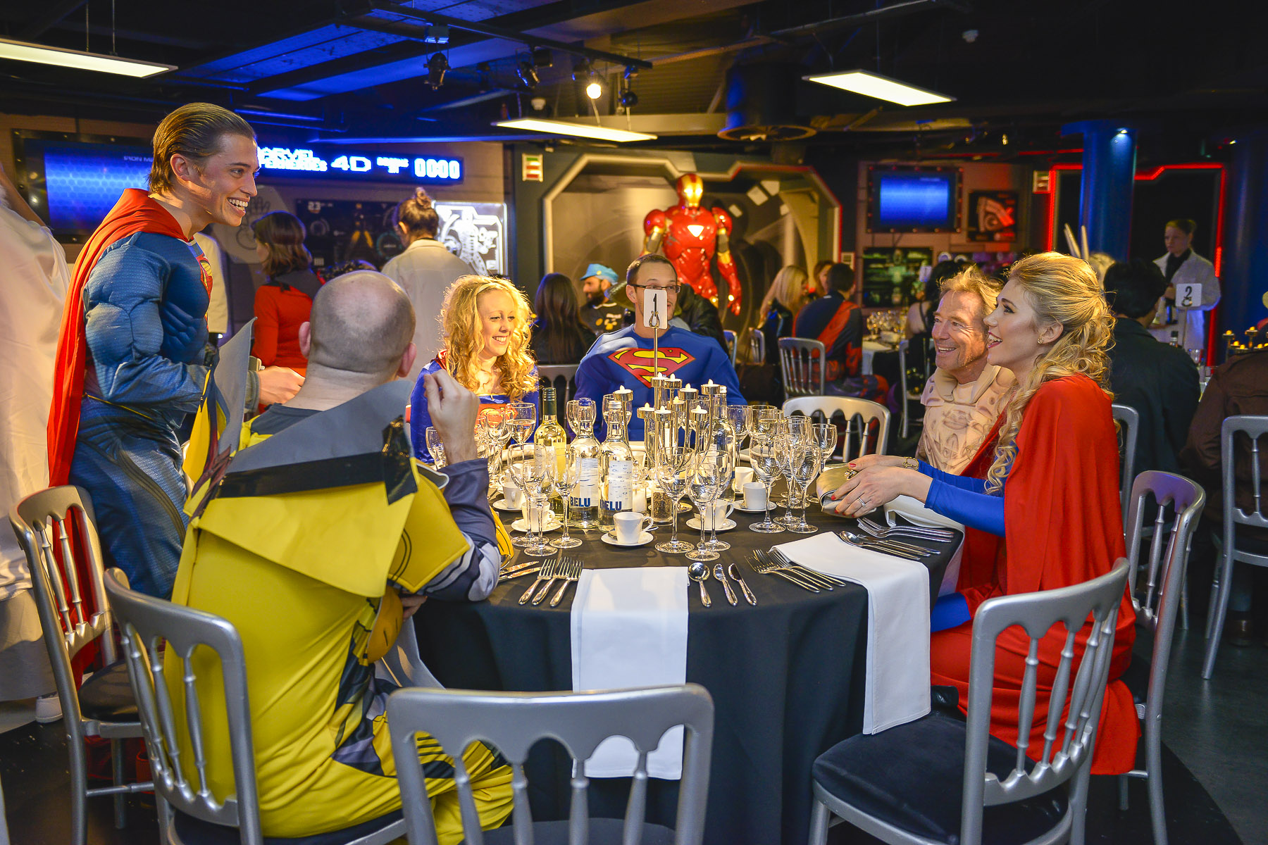 Superhero-themed event at Madame Tussauds with elegant decor and networking opportunities.