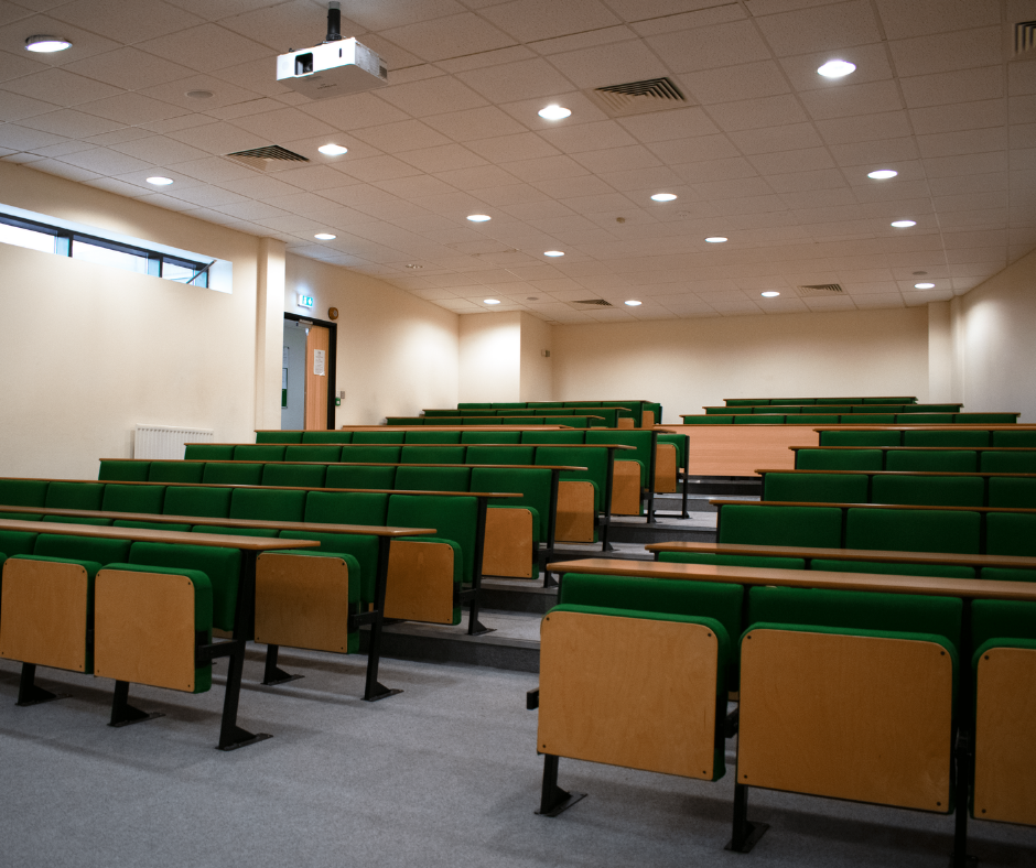 BCOM Lecture Theatre with tiered green seating, ideal for educational events and workshops.