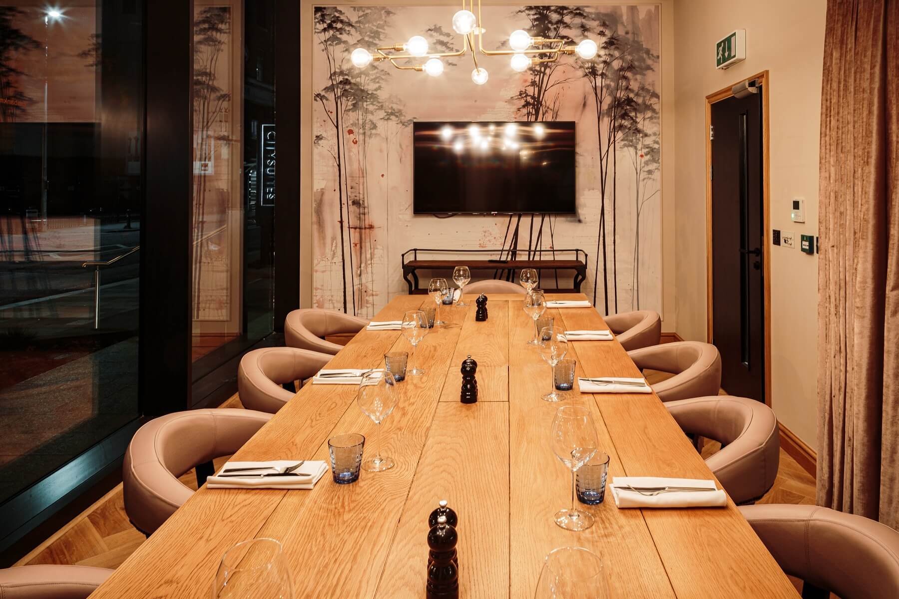 Private dining room with elegant table setting for meetings and events at Embankment Kitchen.