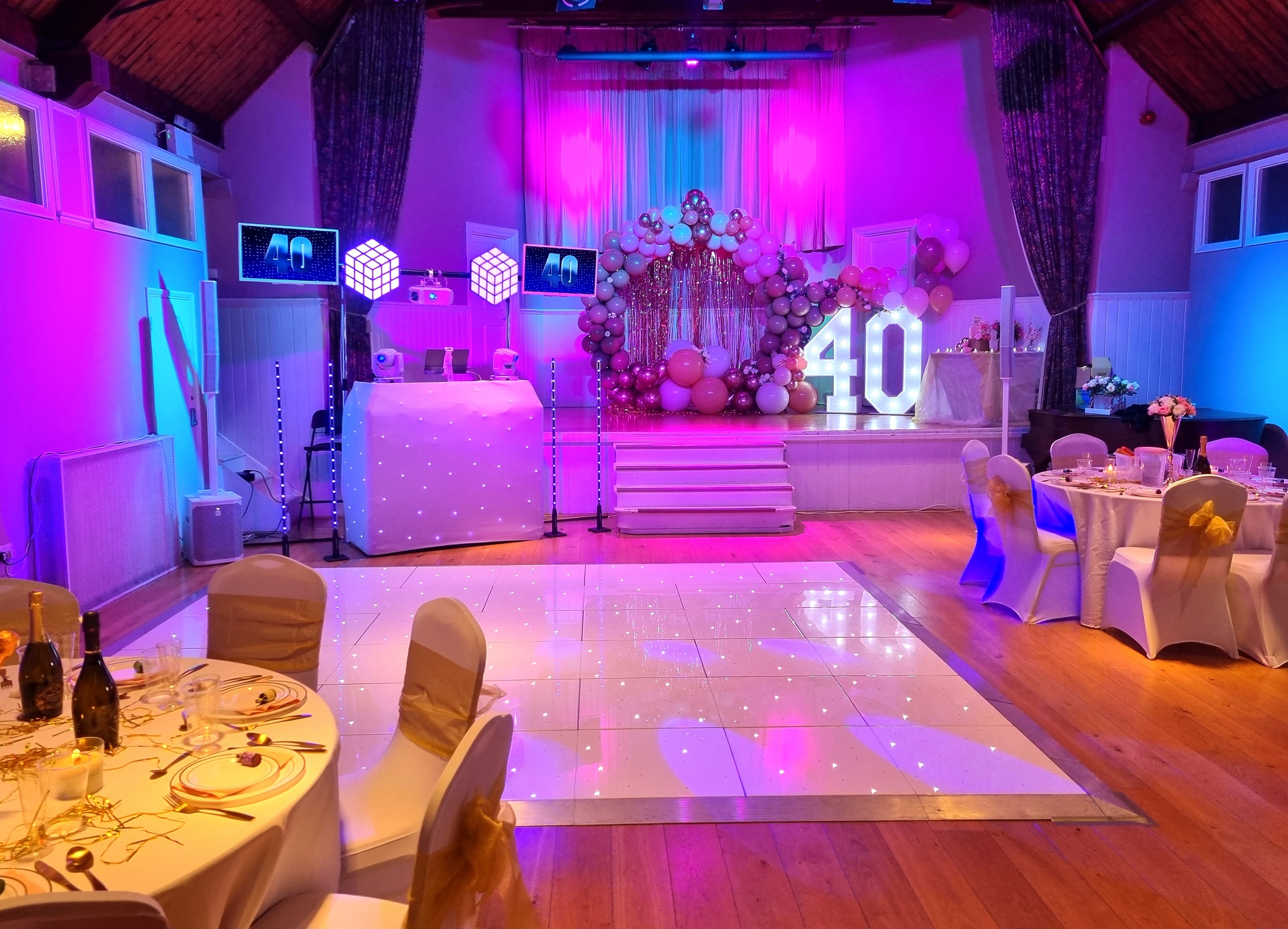 Elegant event space with vibrant lighting for milestone celebrations and parties.