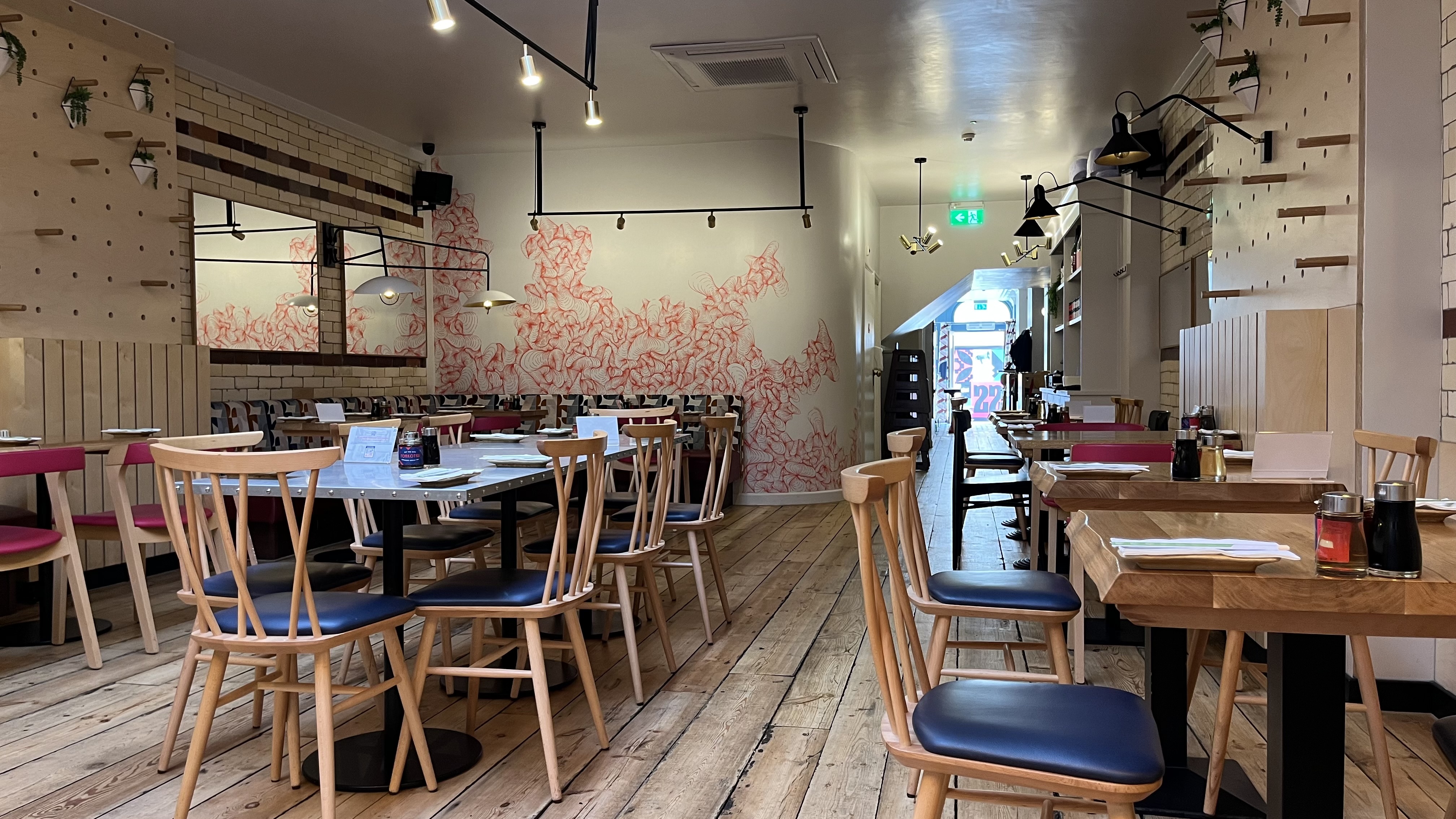 Ramen Bar Brighton: cozy dining space with pink decor, perfect for casual events.