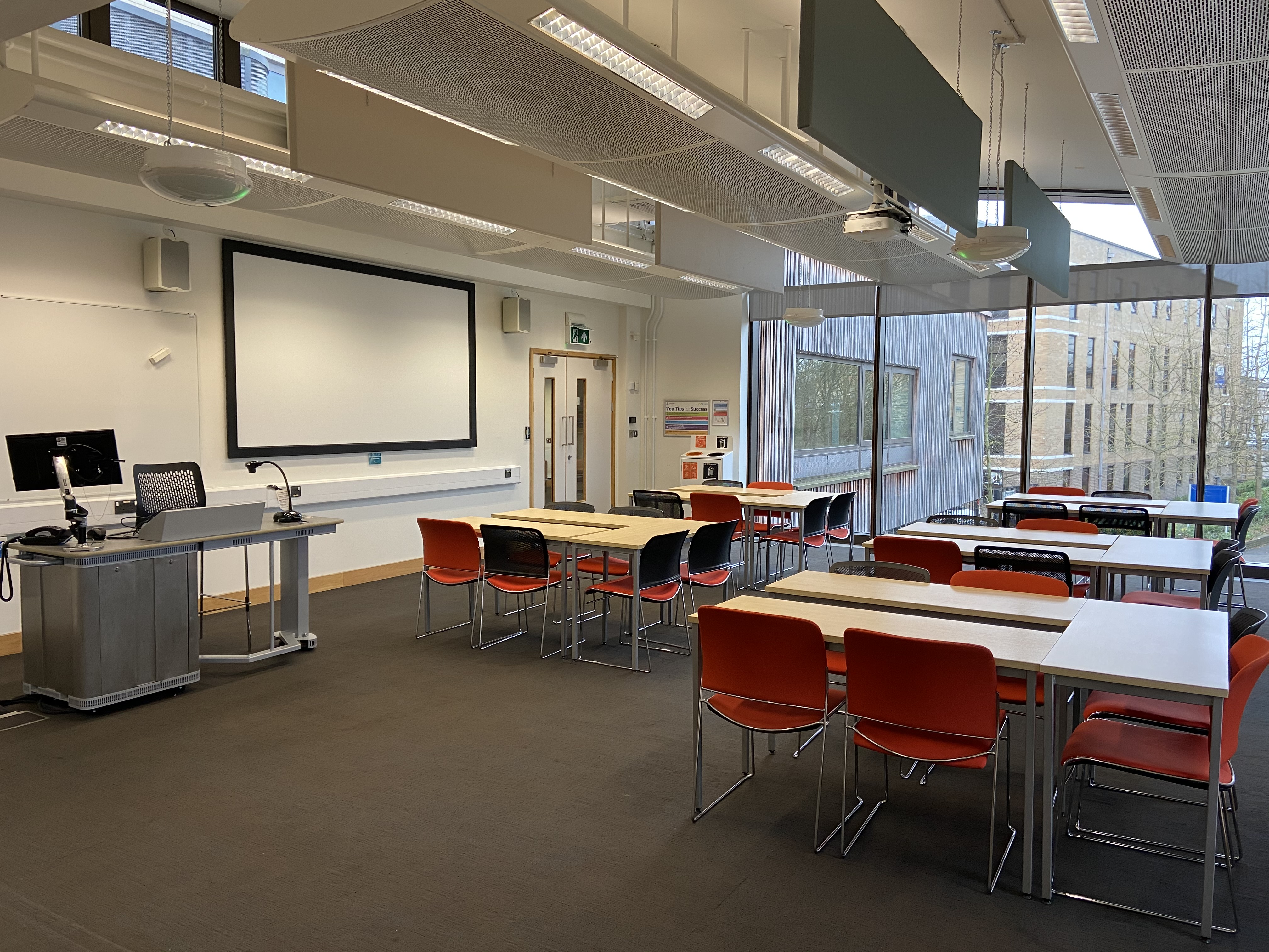 Modern medium classroom with natural light for workshops at ARU Venue Hire, Cambridge.