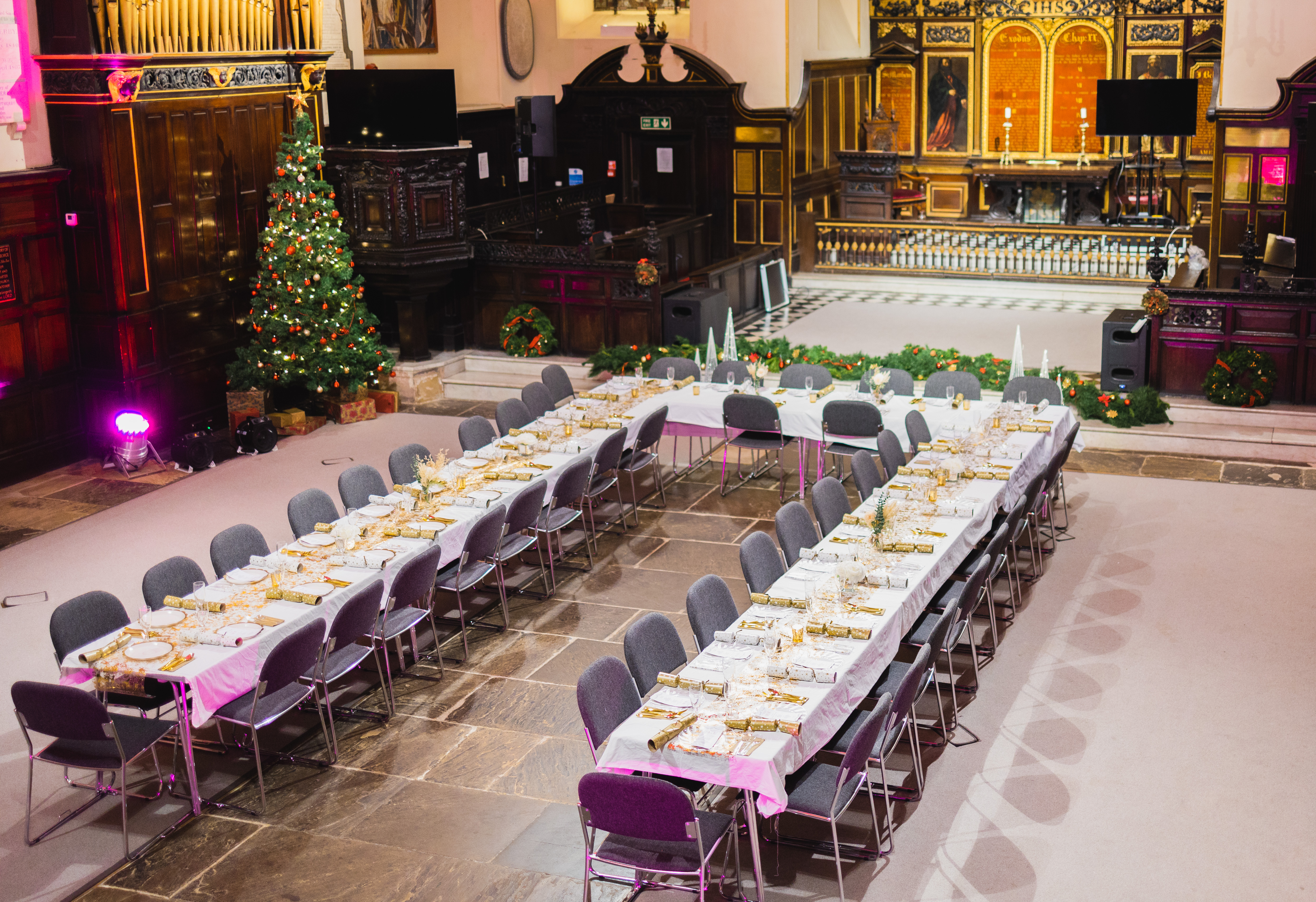 Elegant banquet setup in St Edmund the King for festive corporate events and holiday celebrations.