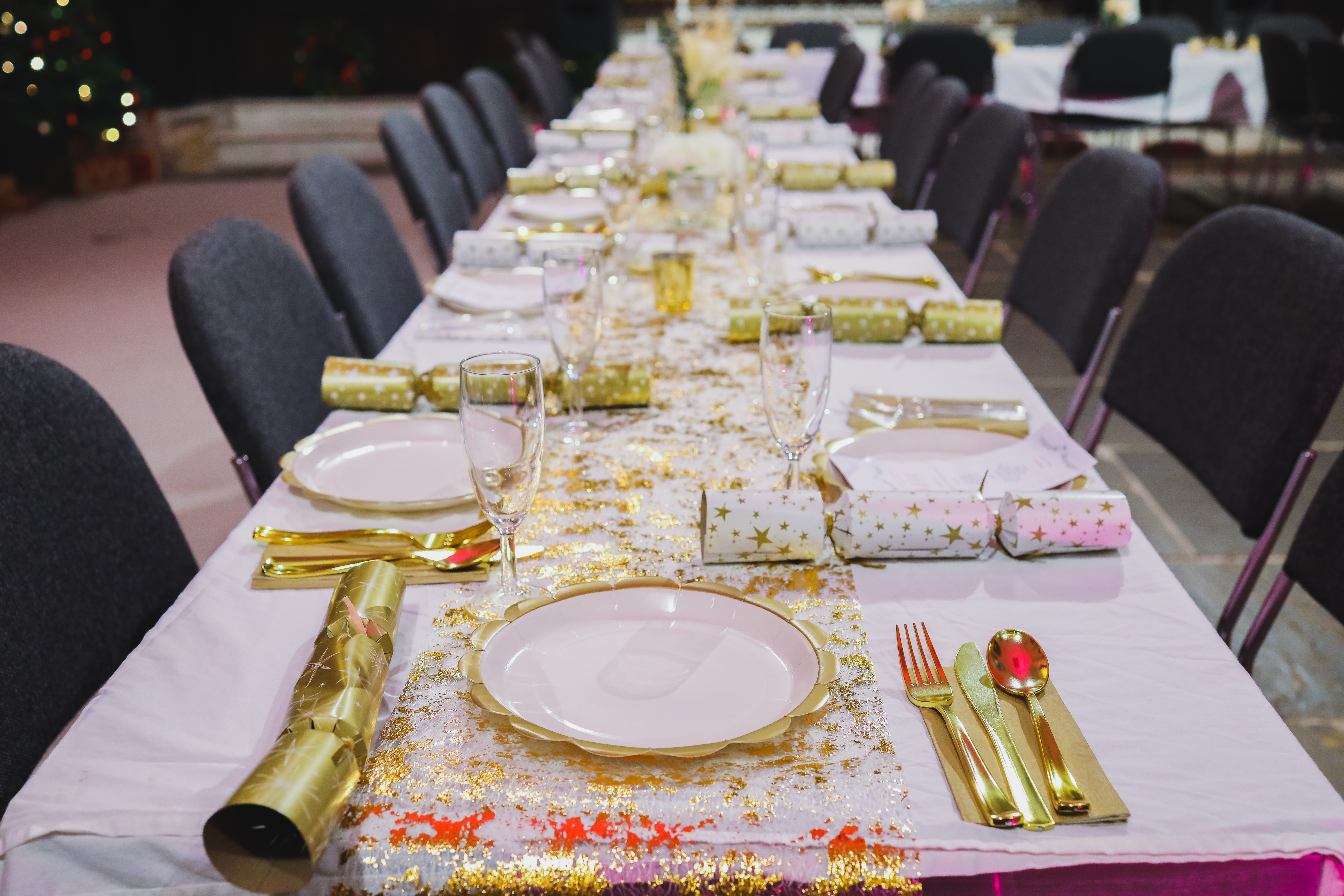 Elegant banquet table in gold and white for corporate event or holiday celebration.
