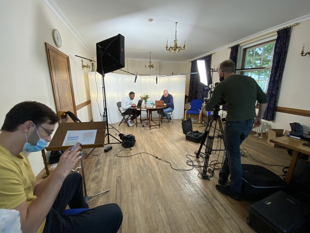 Hybrid meeting setup at The Vestry Hall with speakers and professional lighting.