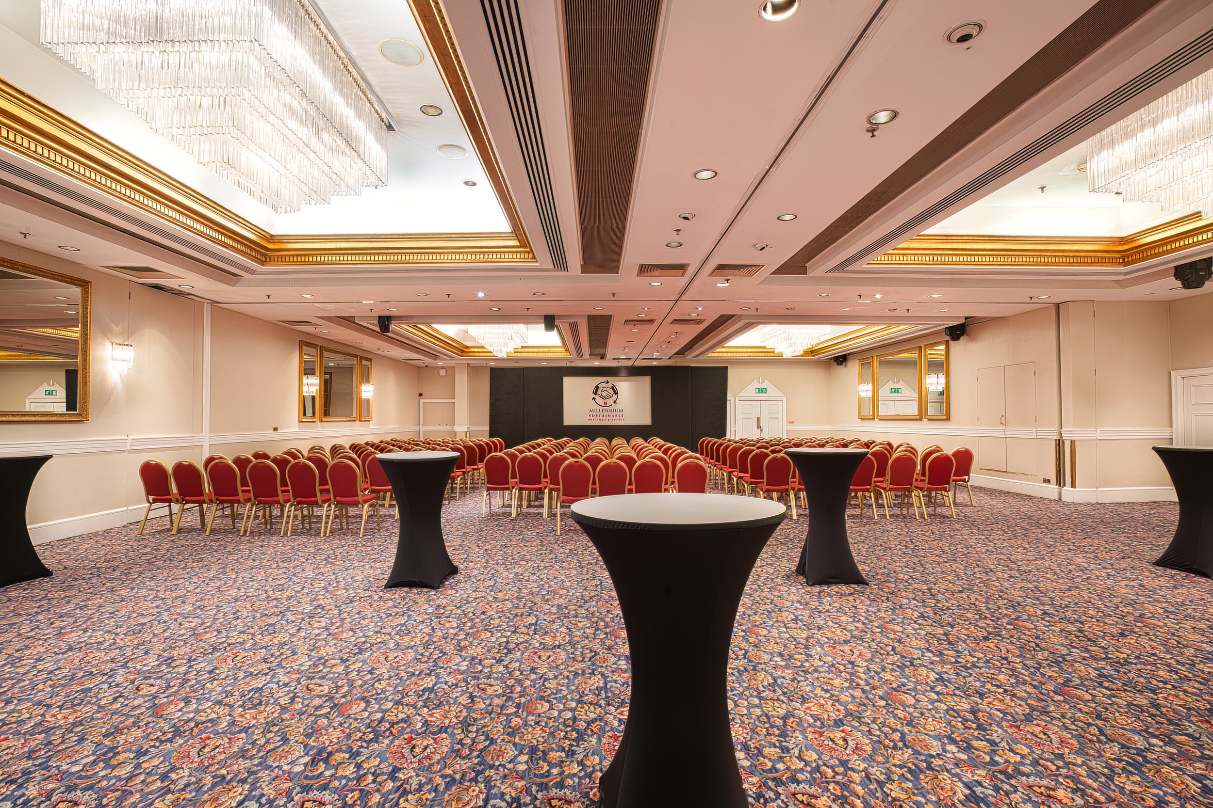 Cromwell Suite event space with elegant chandeliers for networking and receptions.