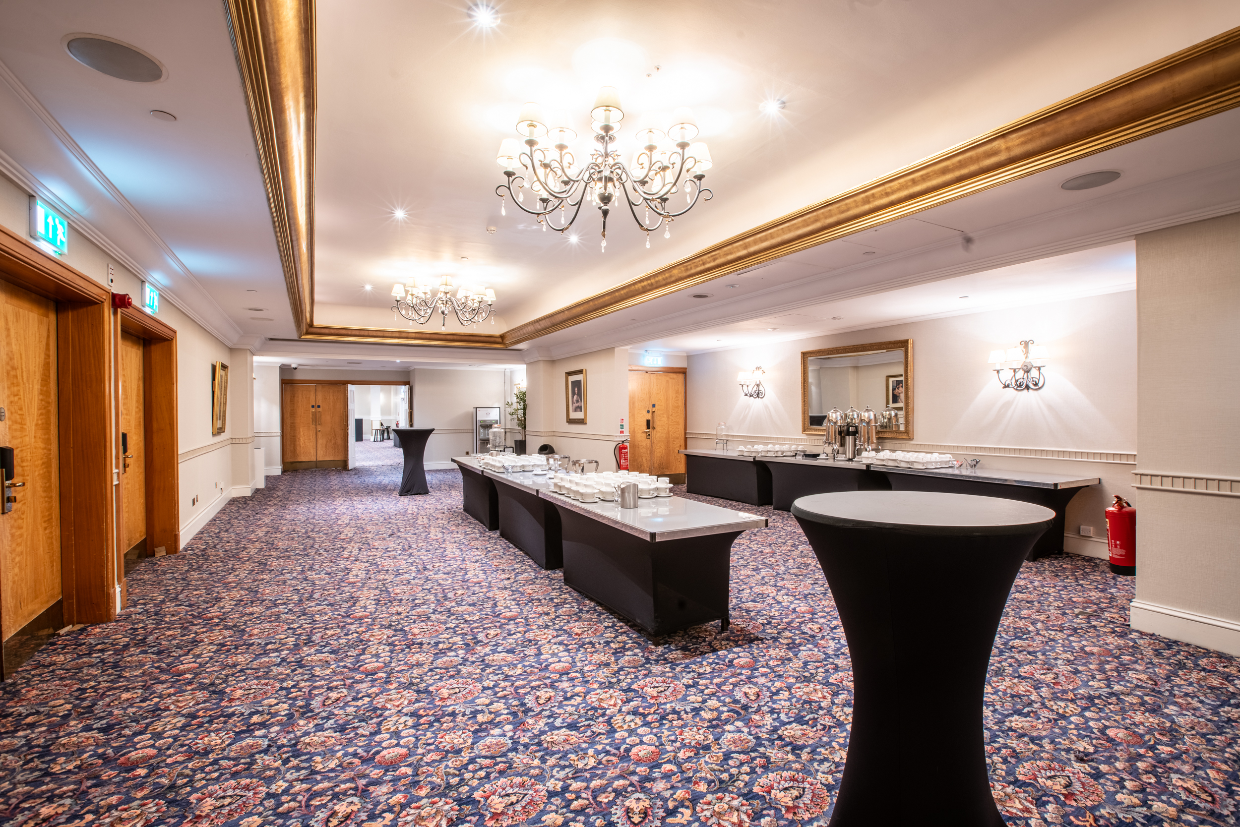 Cromwell Suite, elegant event space with chandeliers, ideal for networking and receptions.