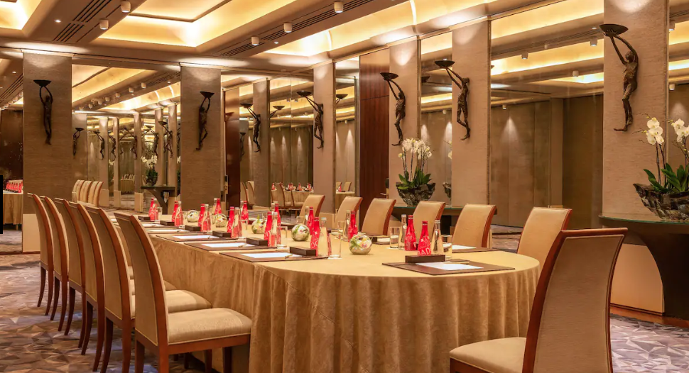 Sophisticated meeting room with round table for corporate events at Park Hyatt Paris.