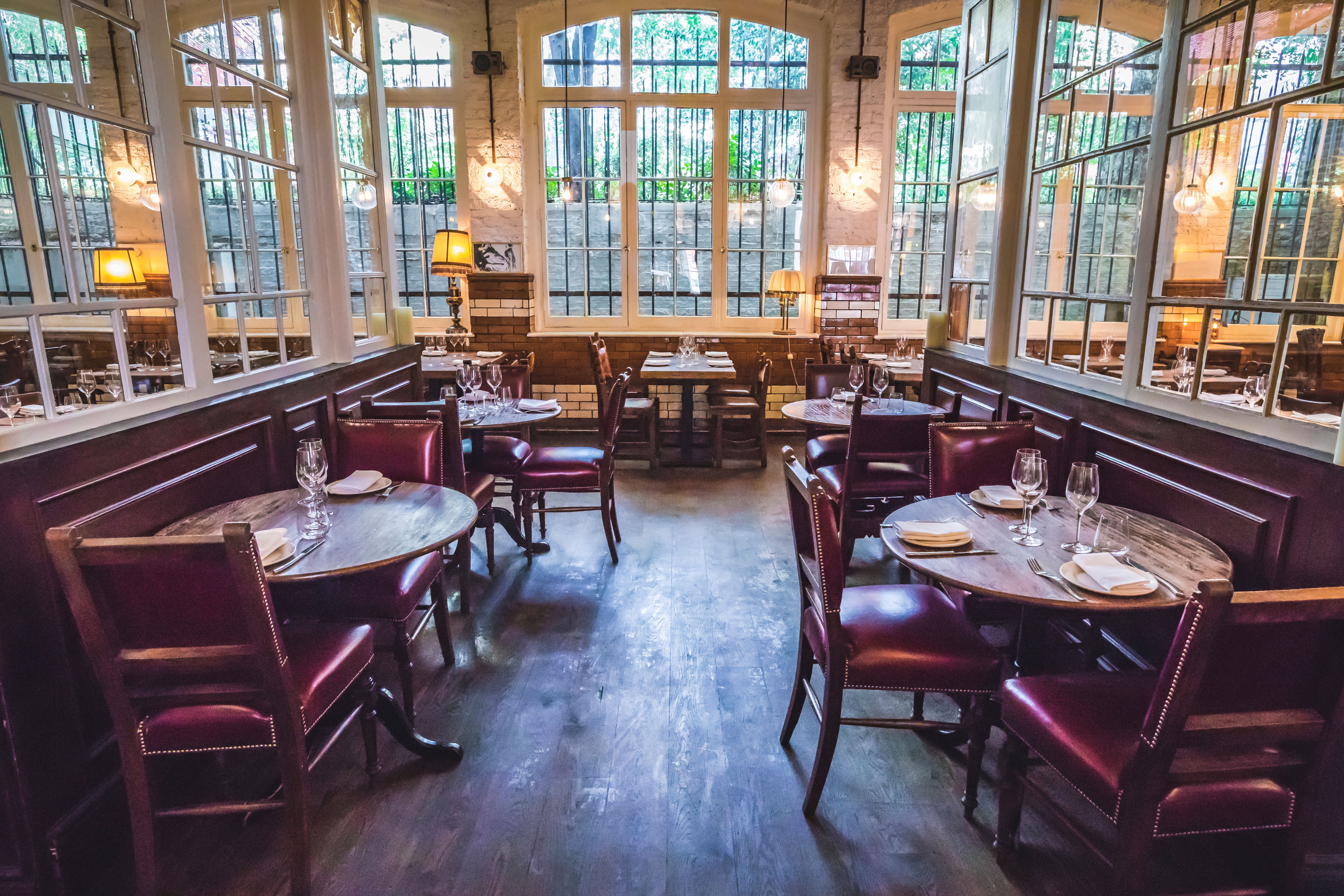 Charming Ibérica Farringdon restaurant with warm lighting for intimate gatherings and meetings.