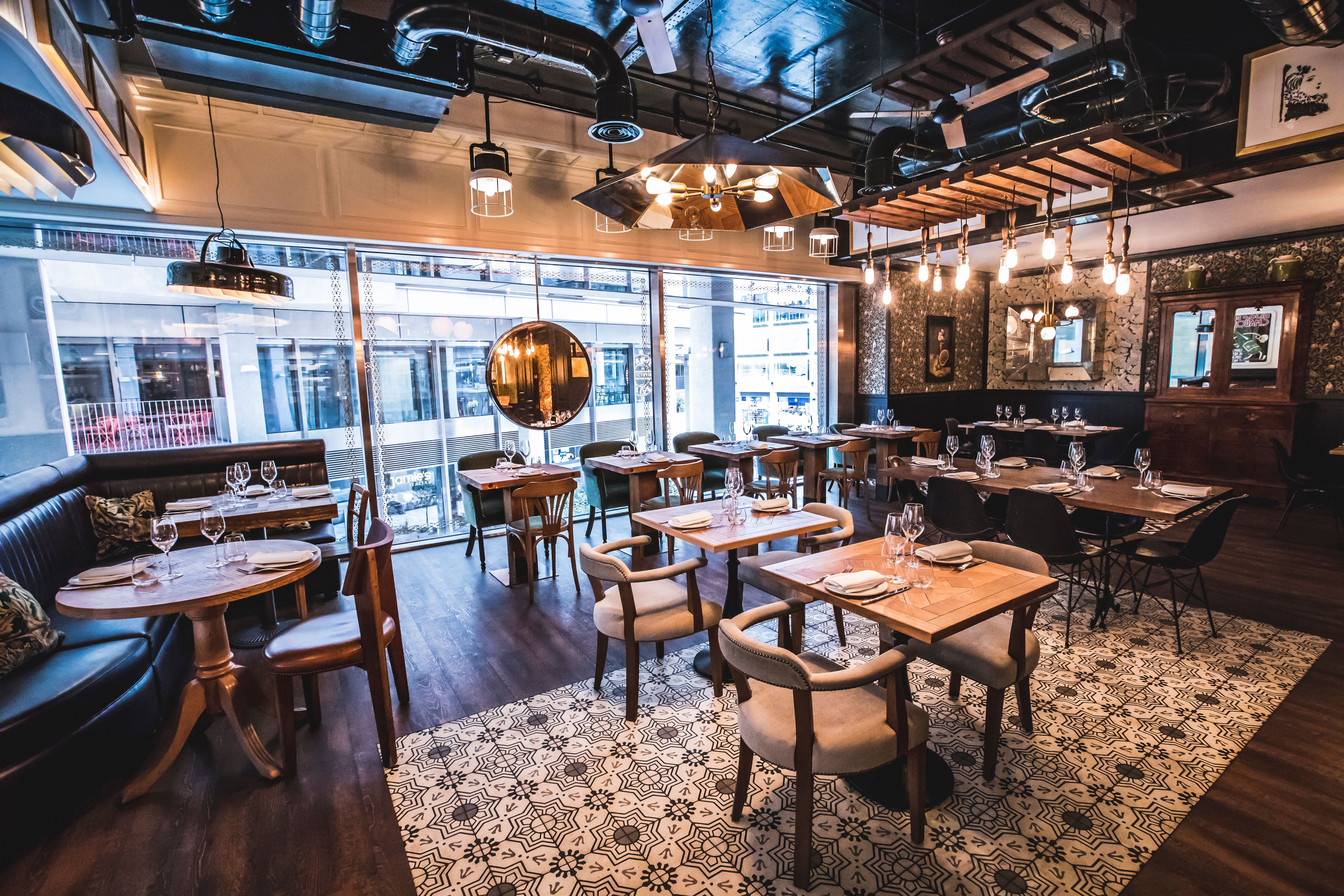 Stylish Ibérica Victoria restaurant with warm lighting, ideal for corporate events and gatherings.