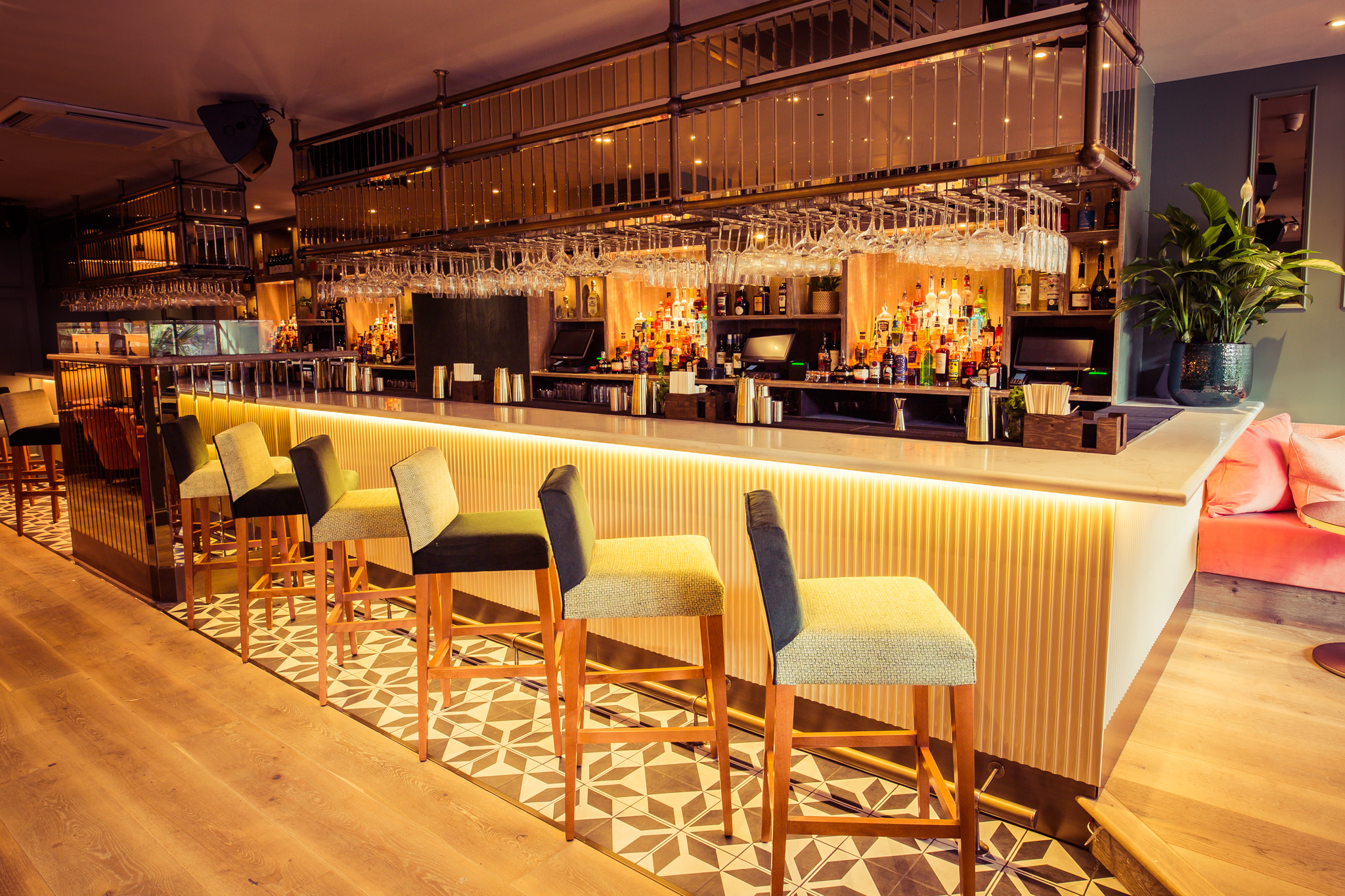 Stylish cocktail bar with ample seating, perfect for networking events and receptions.