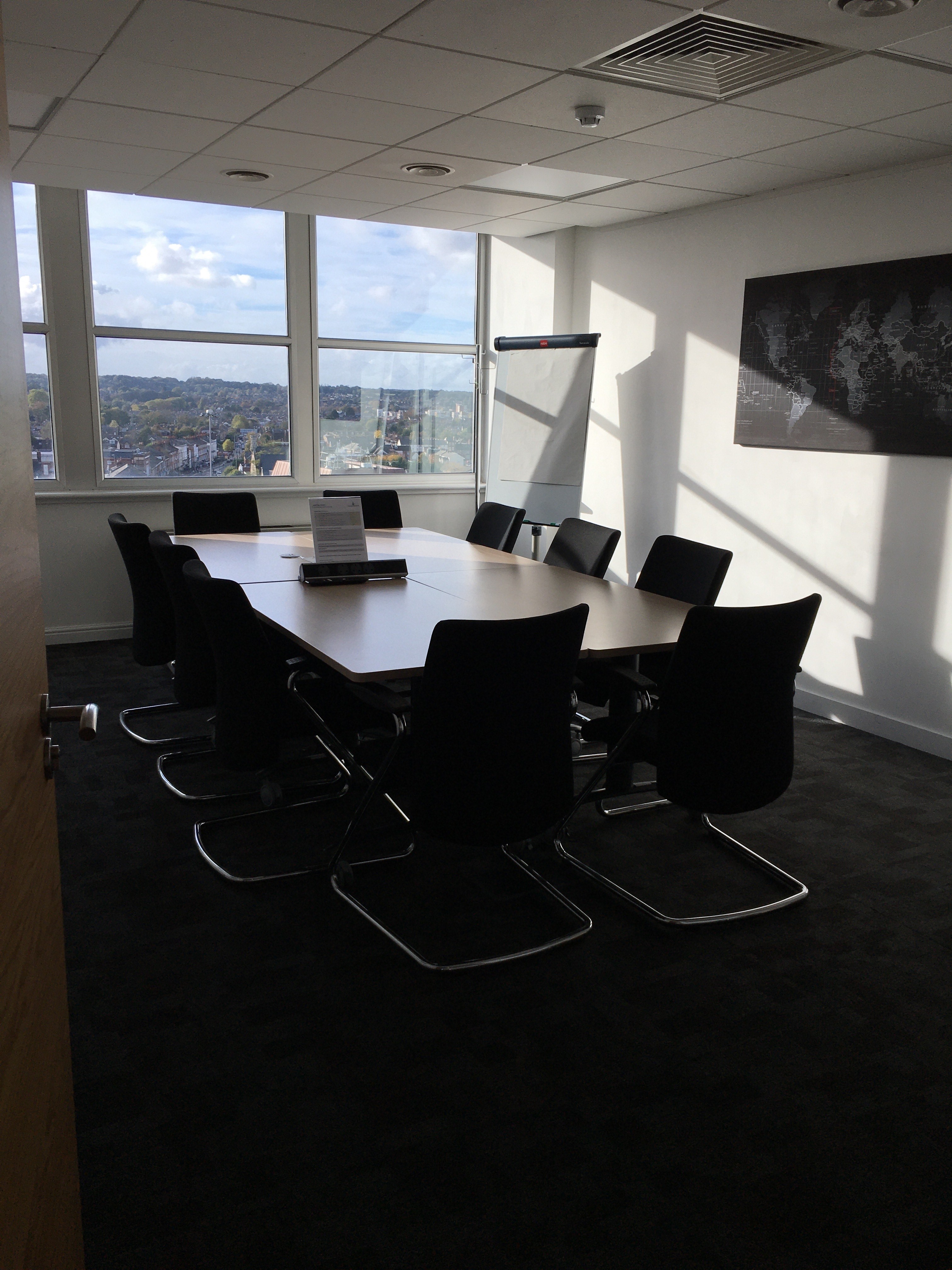 Modern conference room with large table, ideal for meetings and events in Reading.