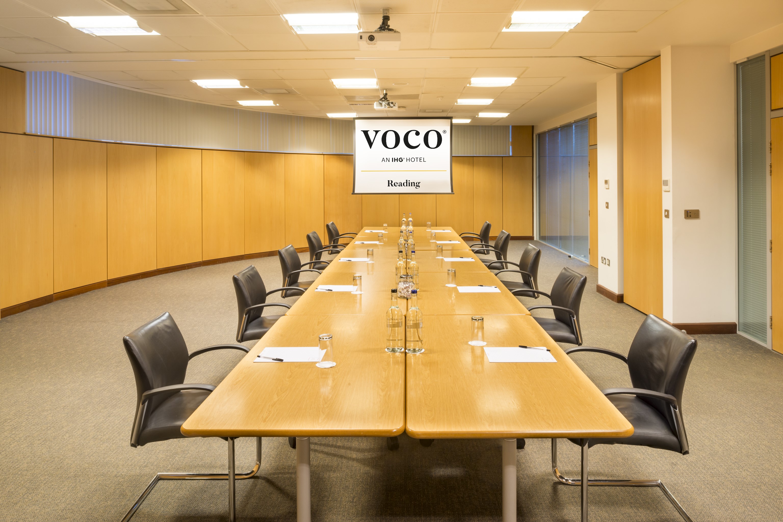 Kendrick and Abbey Suites meeting room with polished table, ideal for business workshops.