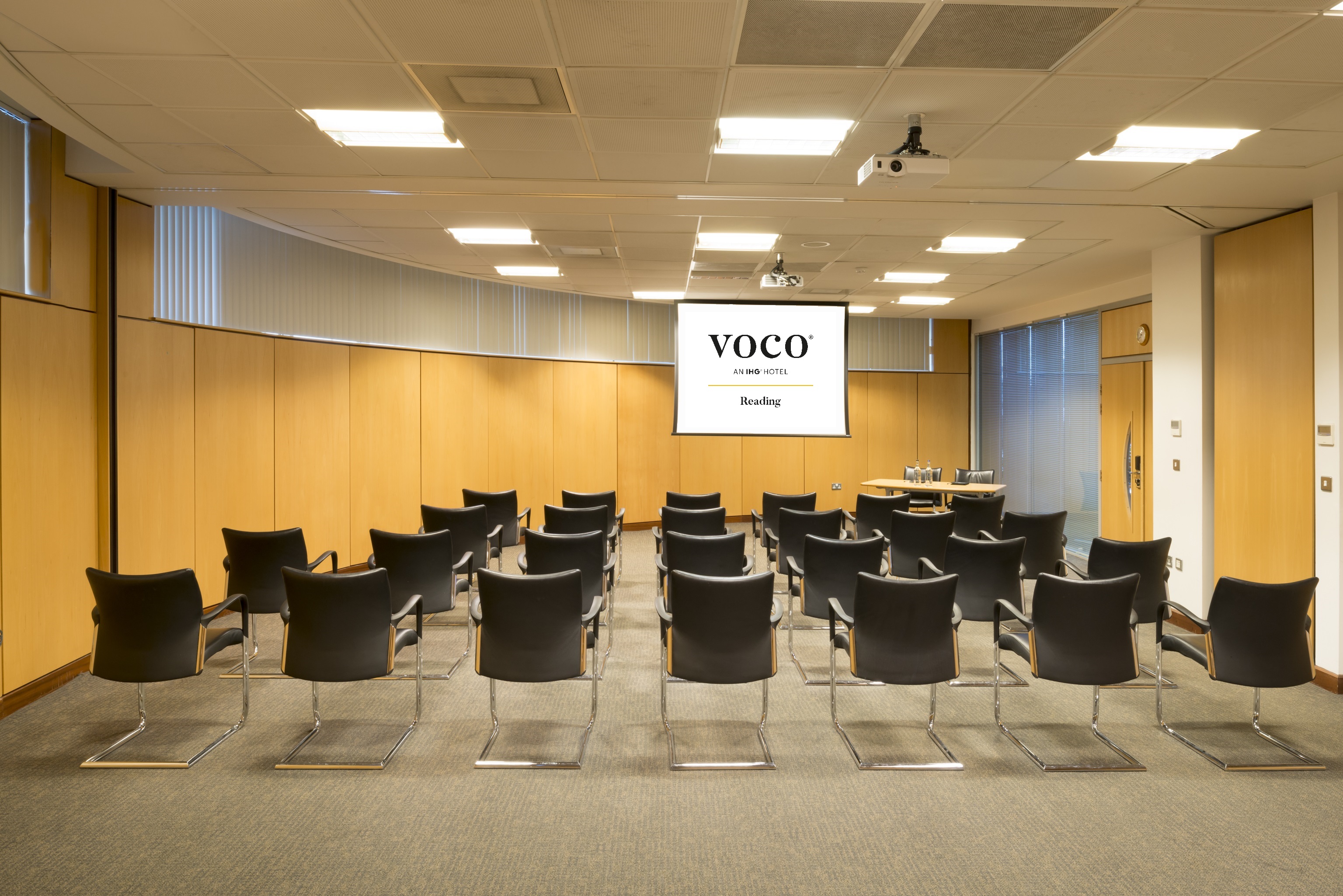 Kendrick and Abbey Suites meeting room setup for professional presentations in Voco Reading.