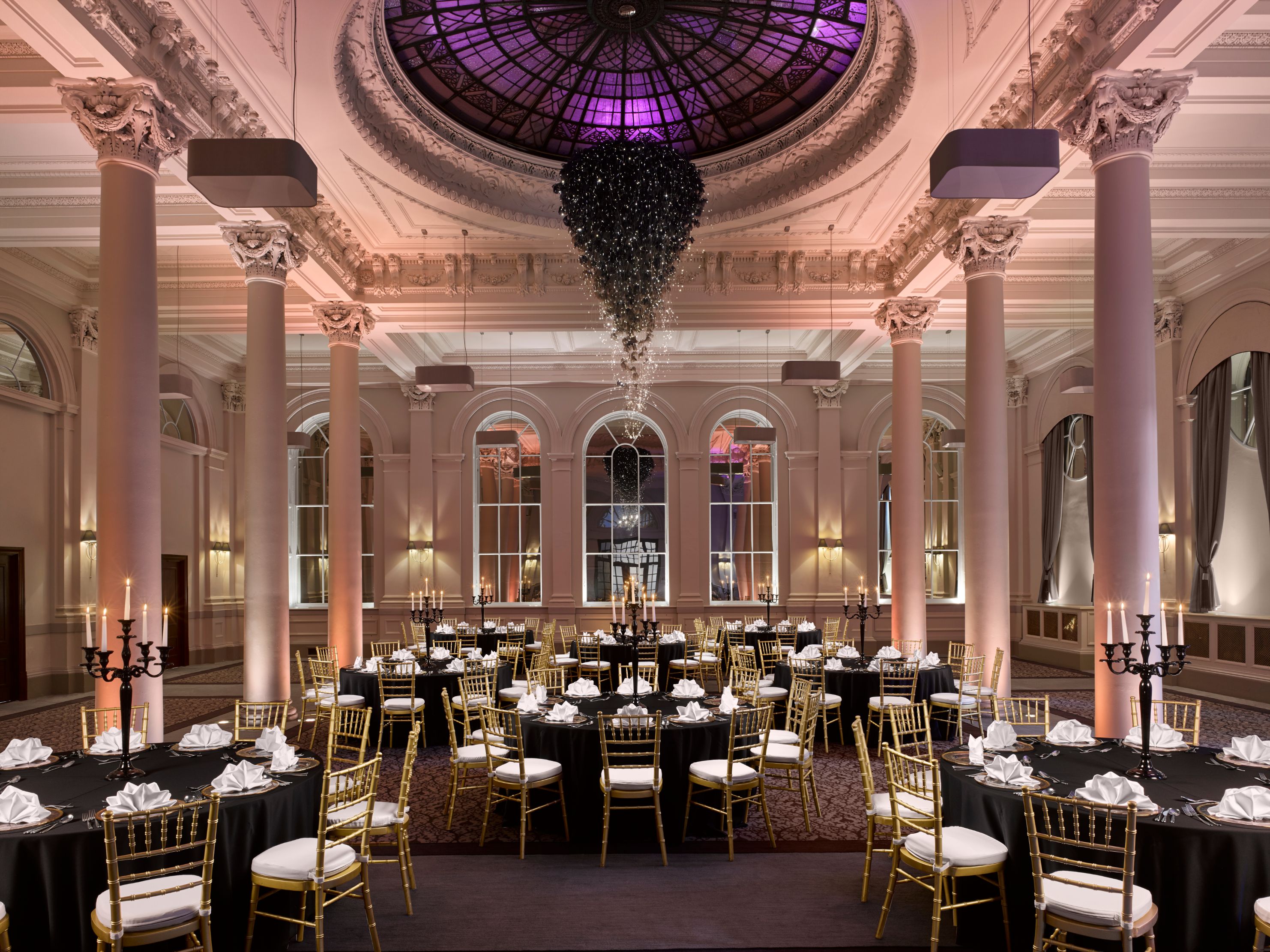 Elegant Kings Hall venue with black linens, ideal for formal dinners and galas.