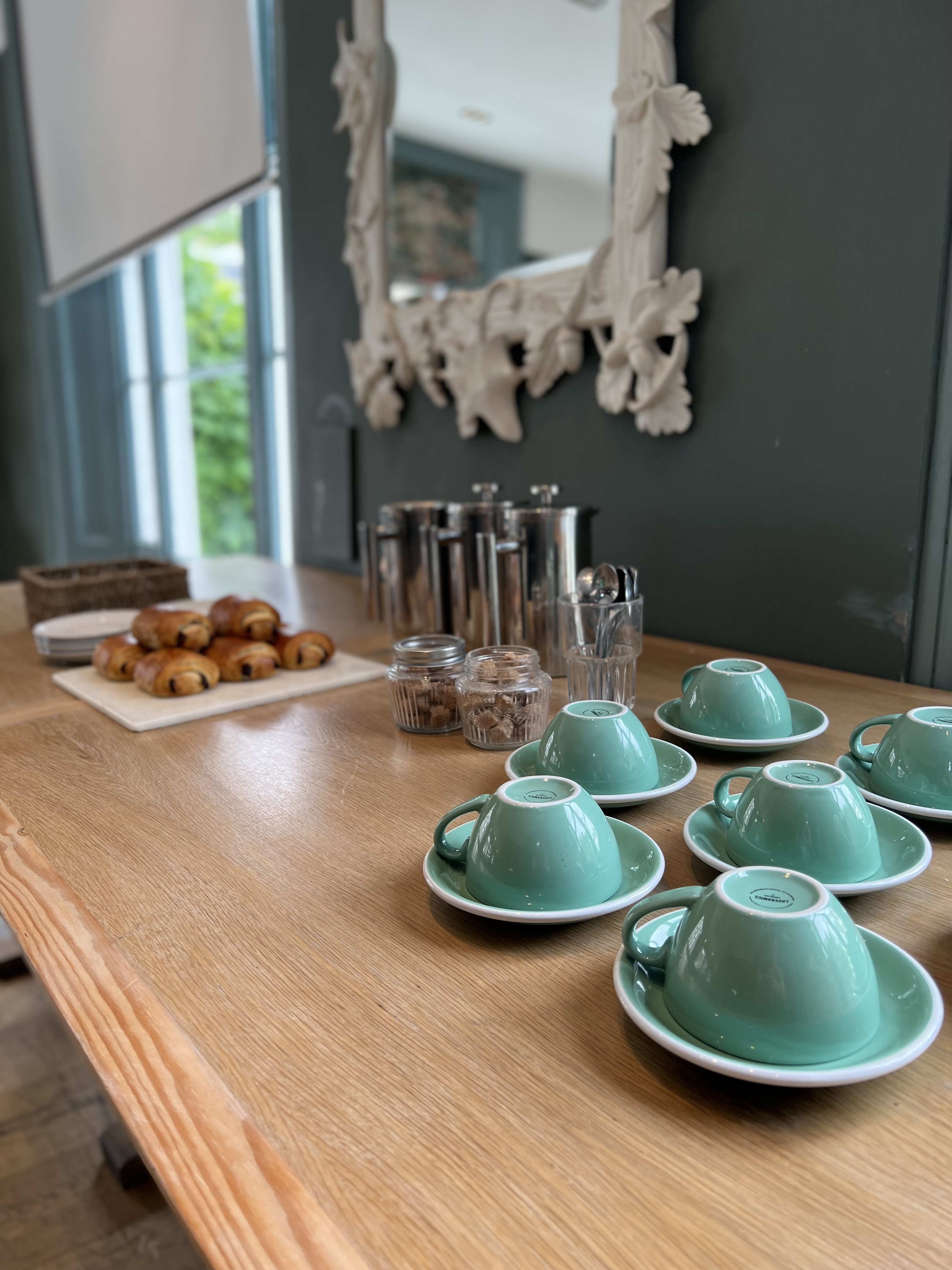 Chef's Table at The Phene: modern refreshment station for meetings with mint-colored cups.