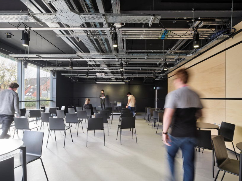 Modern event space in Contact Theatre with flexible seating for workshops and presentations.