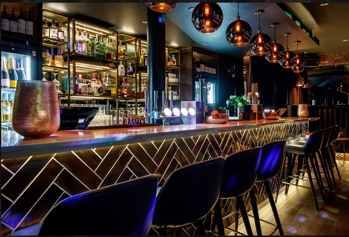 Stylish bar at Velvet Brasserie, ideal for networking events and cocktail receptions.