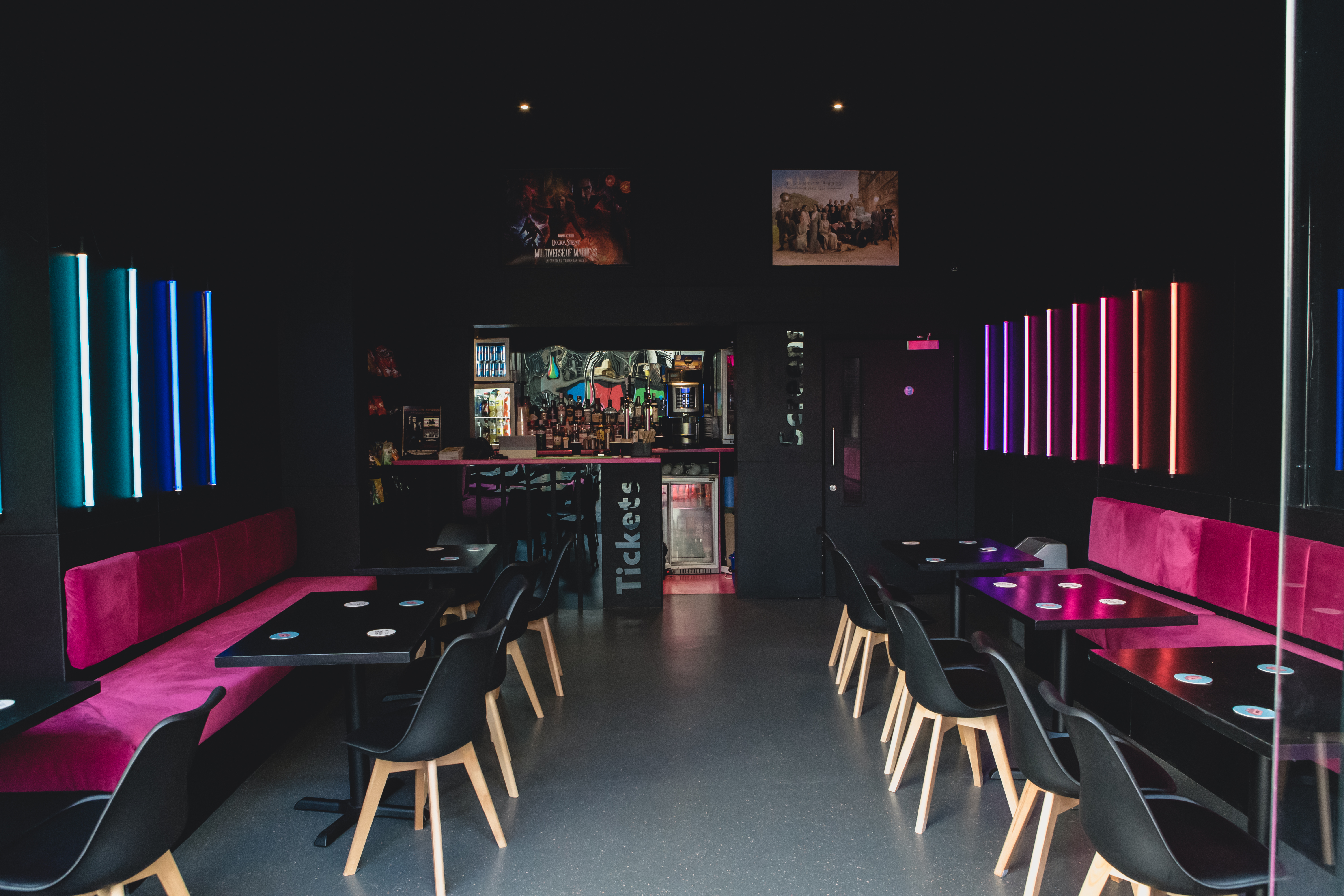 Mockingbird Cinema Bar: modern venue with vibrant lighting for creative events and gatherings.