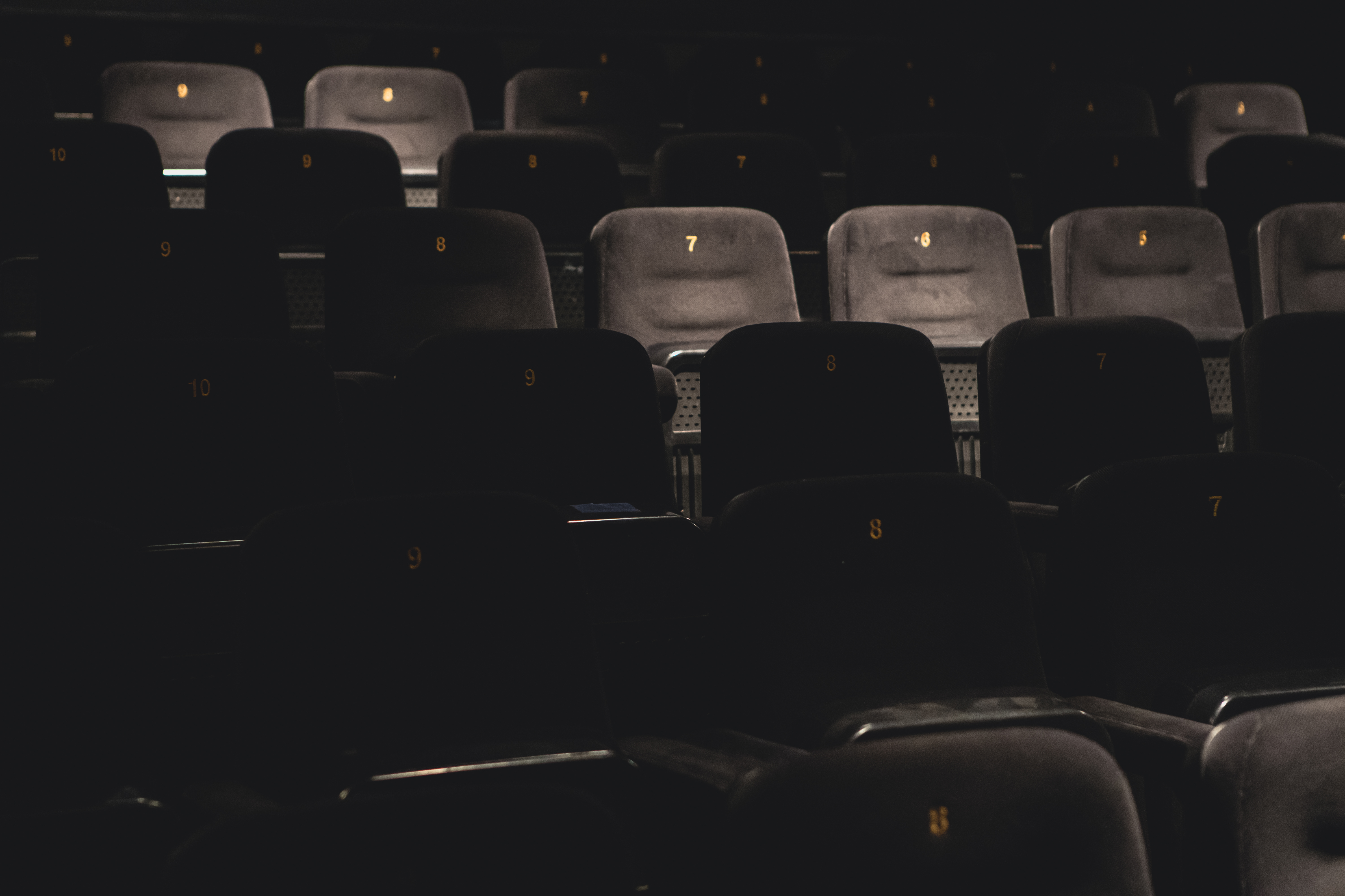 Empty theater seats in Mockingbird Cinema, perfect for intimate presentations and events.