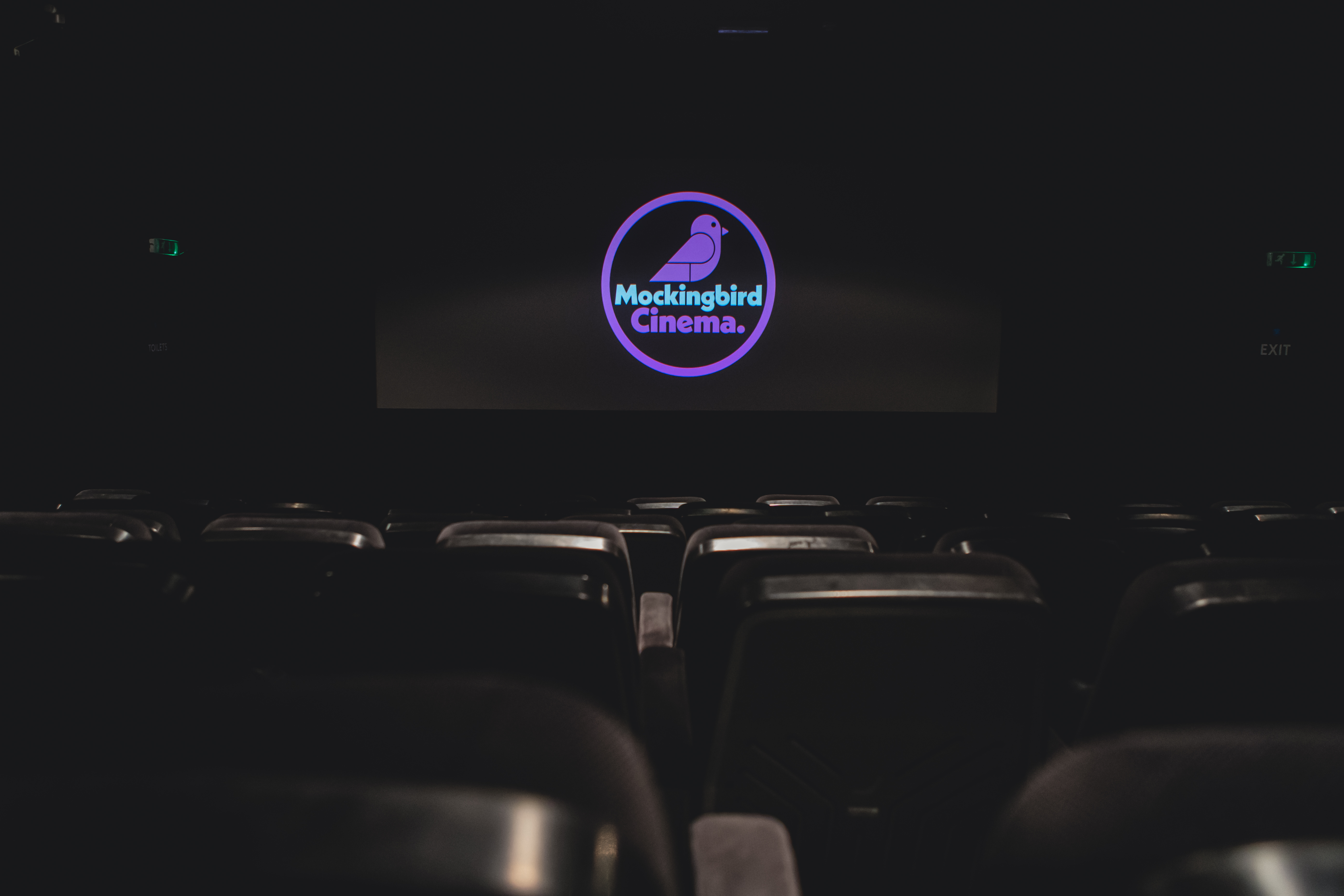 Mockingbird Cinema screen with empty seats, ideal for private film events and premieres.