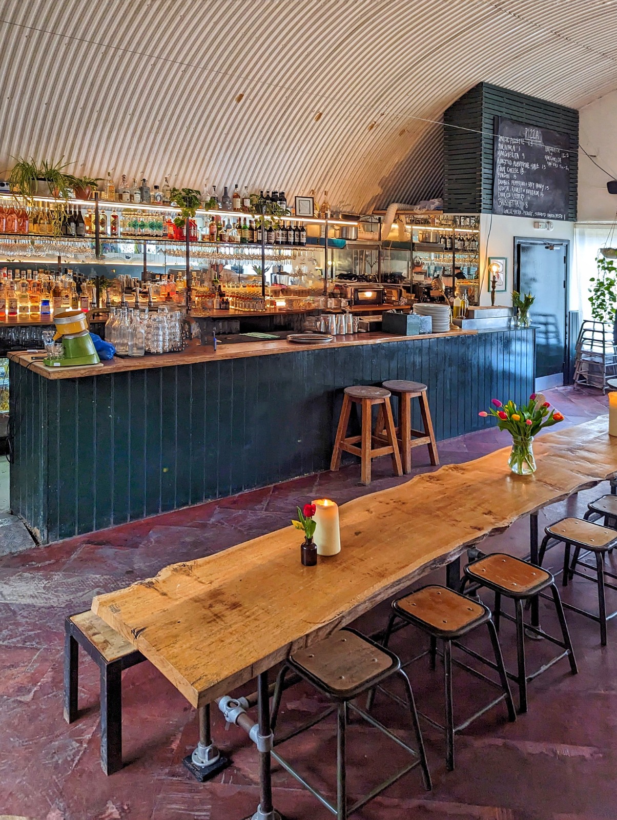 Stylish rustic bar area in The Hawk's Nest, perfect for networking events and celebrations.