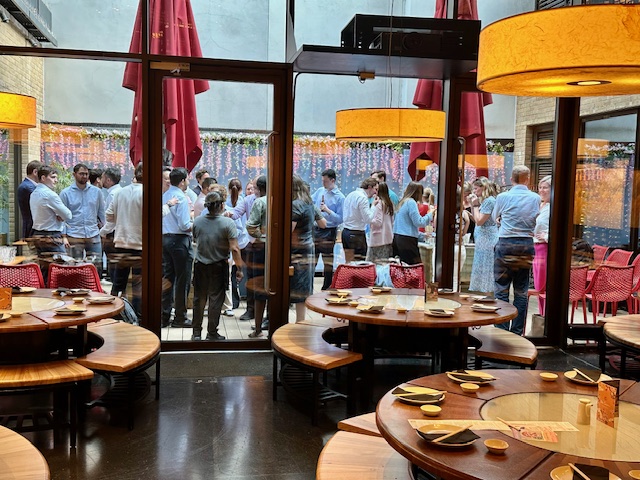 Vibrant networking event in Private Summer Courtyard, Ping Pong Soho with colorful decor.