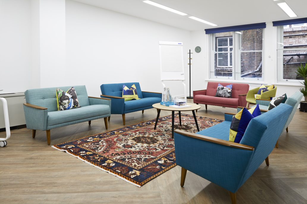 Modern meeting space with colorful seating for creative brainstorming sessions.