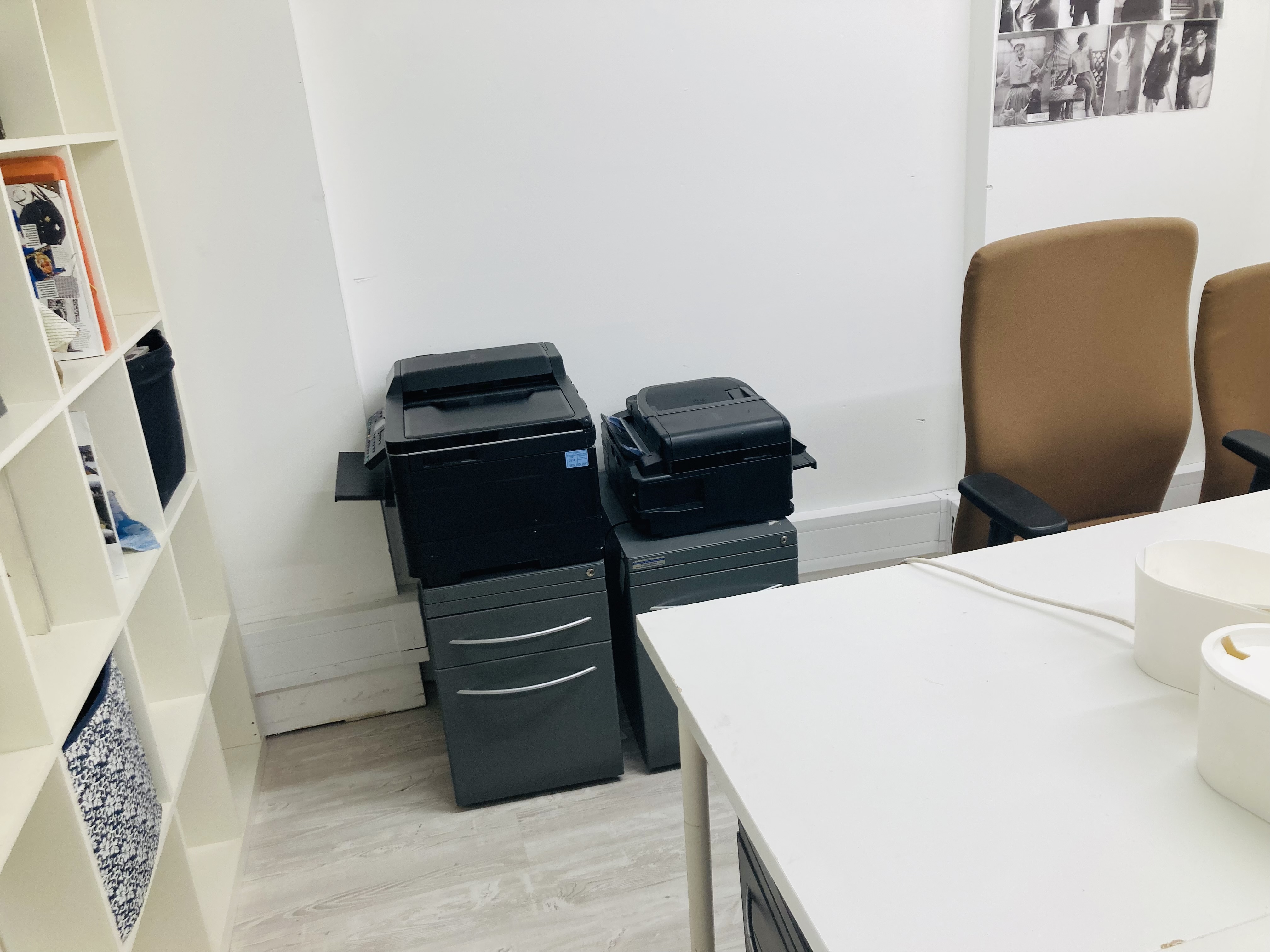 Small office in The Fashion Building with printers, ideal for event planning and document management.