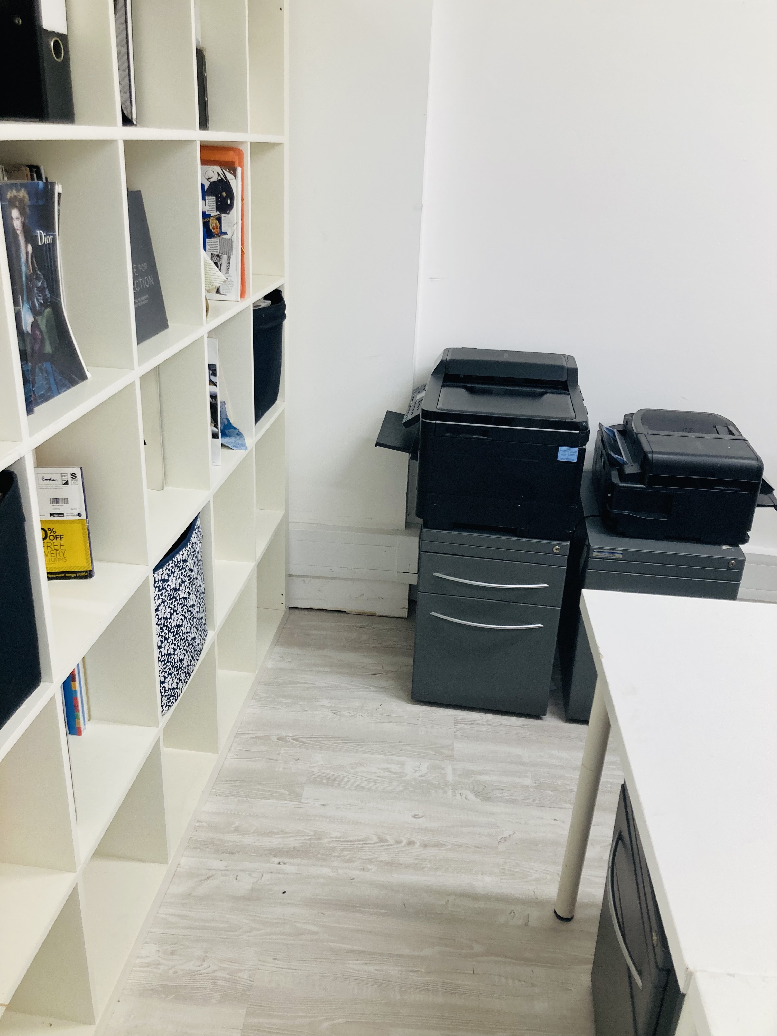Functional workspace in The Fashion Building Basement with organized shelving for event planning.