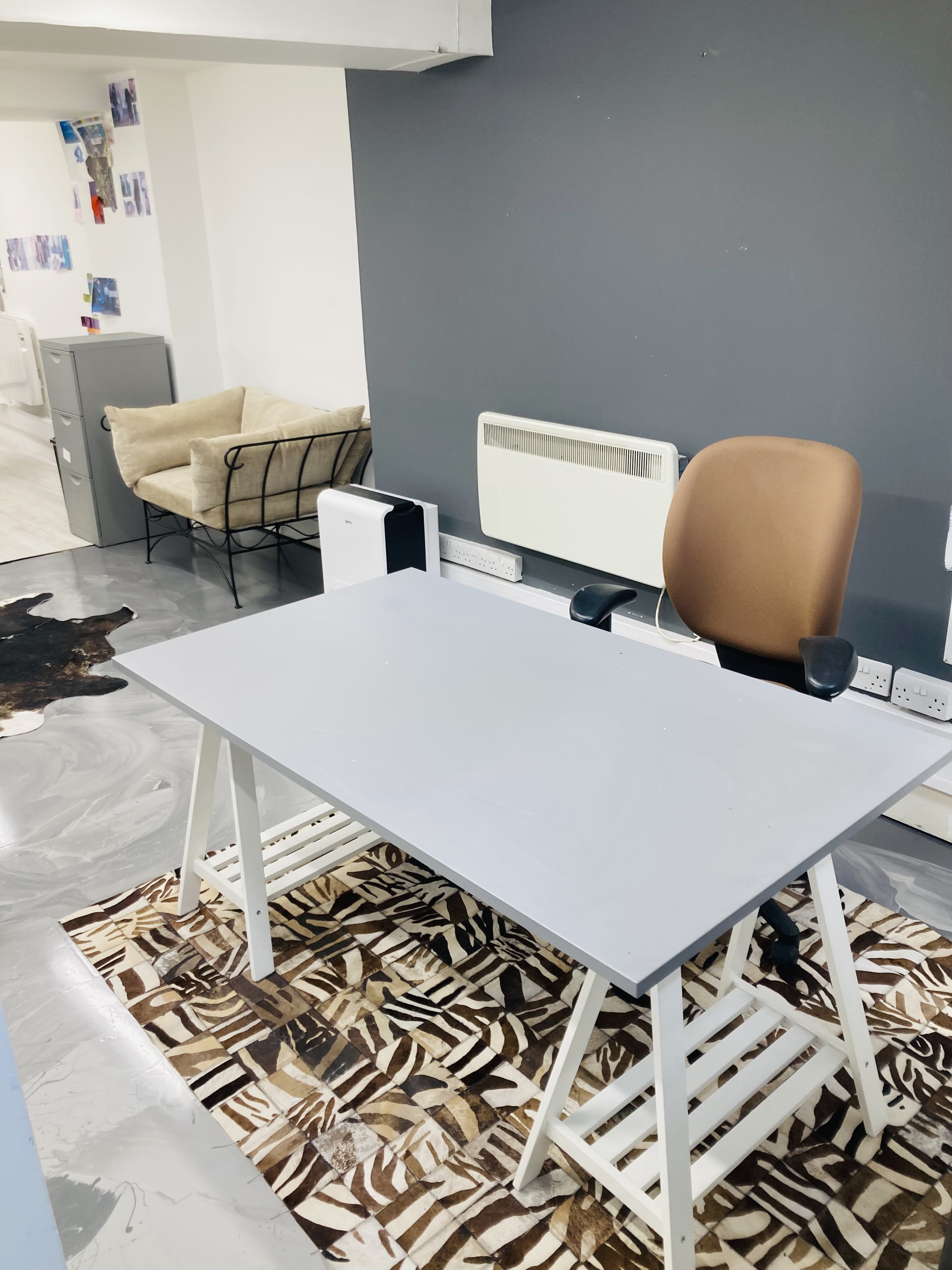 Minimalist workspace in The Fashion Building for meetings and events, promoting collaboration.