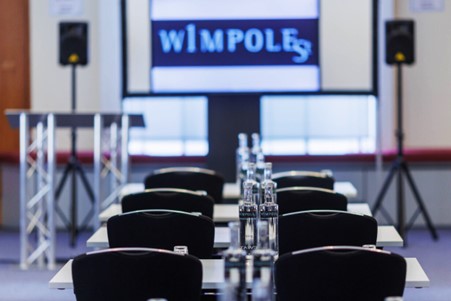 Wheatley Room at 1 Wimpole Street, set for corporate meetings with audio equipment.