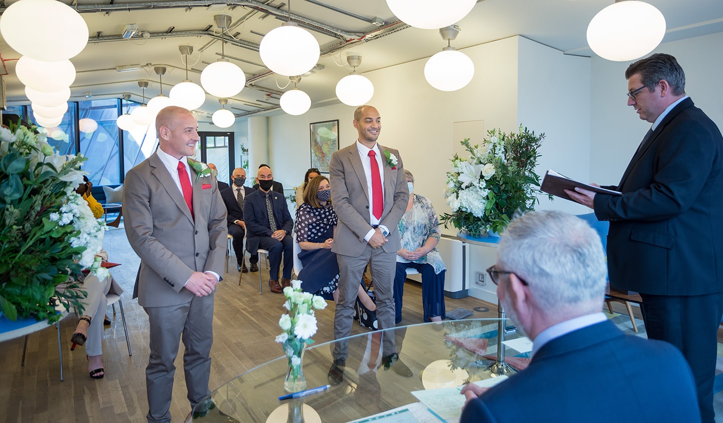 Modern wedding ceremony in Wallacespace Clerkenwell with two grooms and elegant decor.