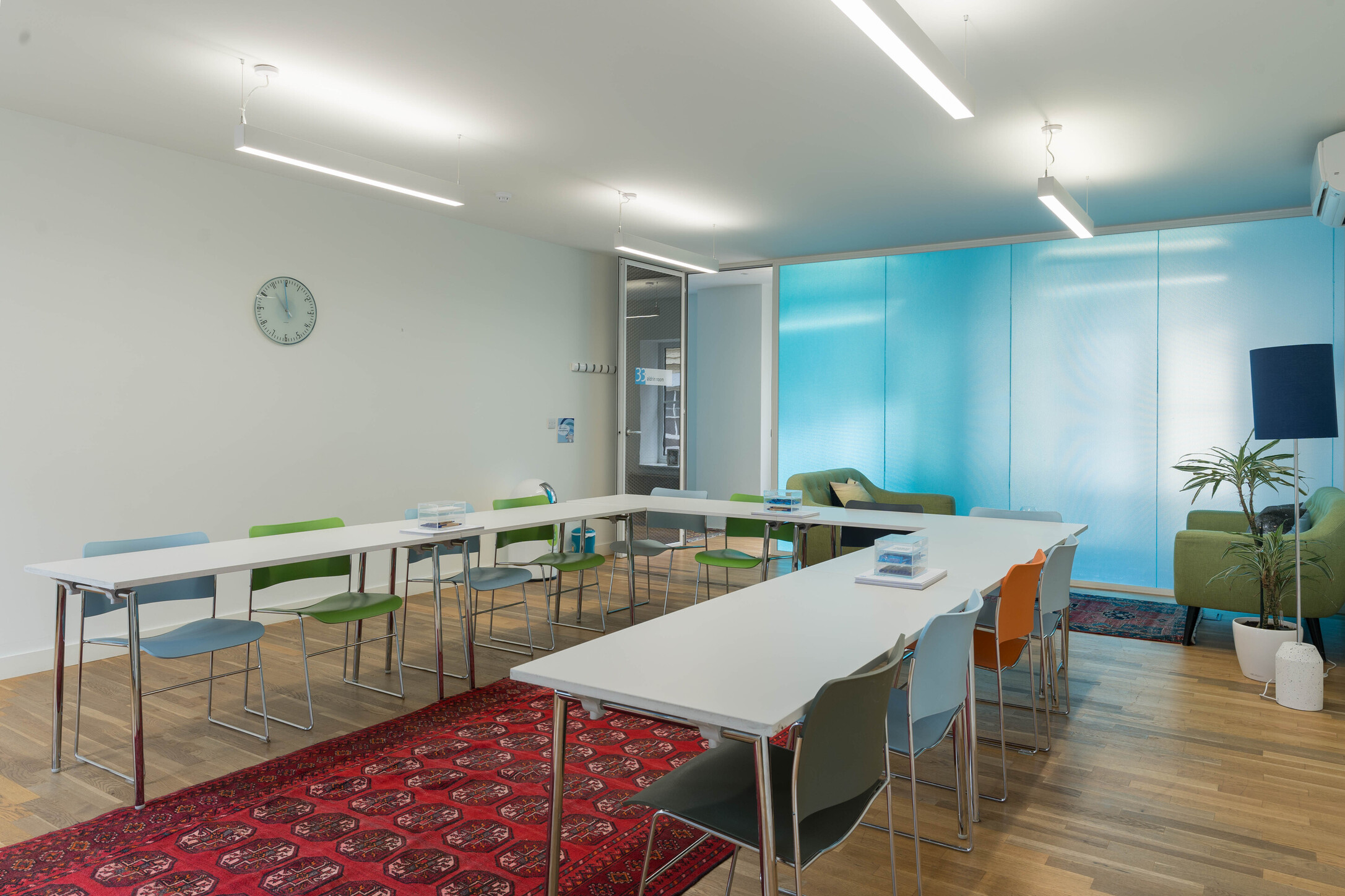 Modern meeting space with colorful chairs for creative collaboration at Wallacespace Spitalfields.