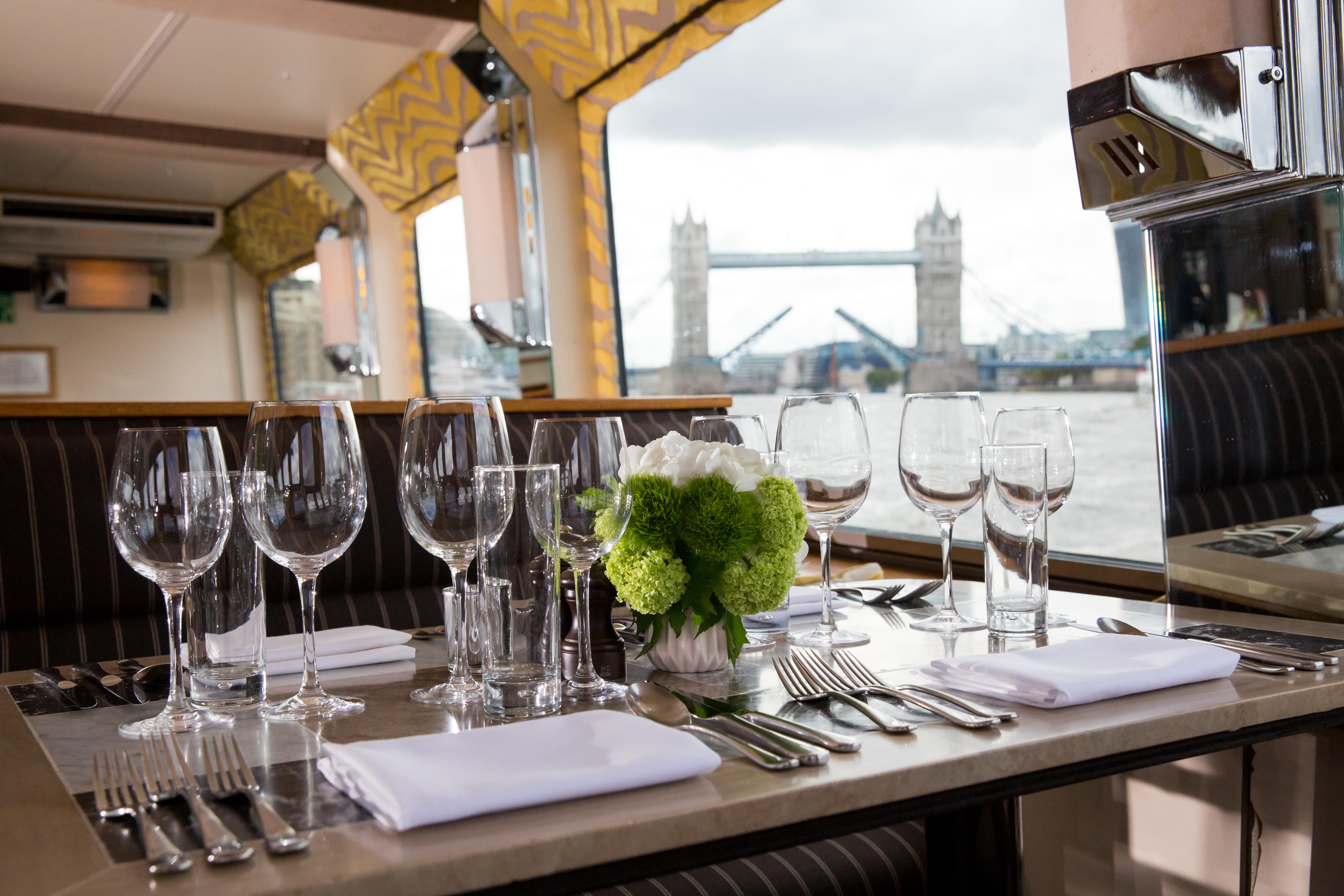 Elegant dining table on Silver Barracuda with Tower Bridge view for upscale events.