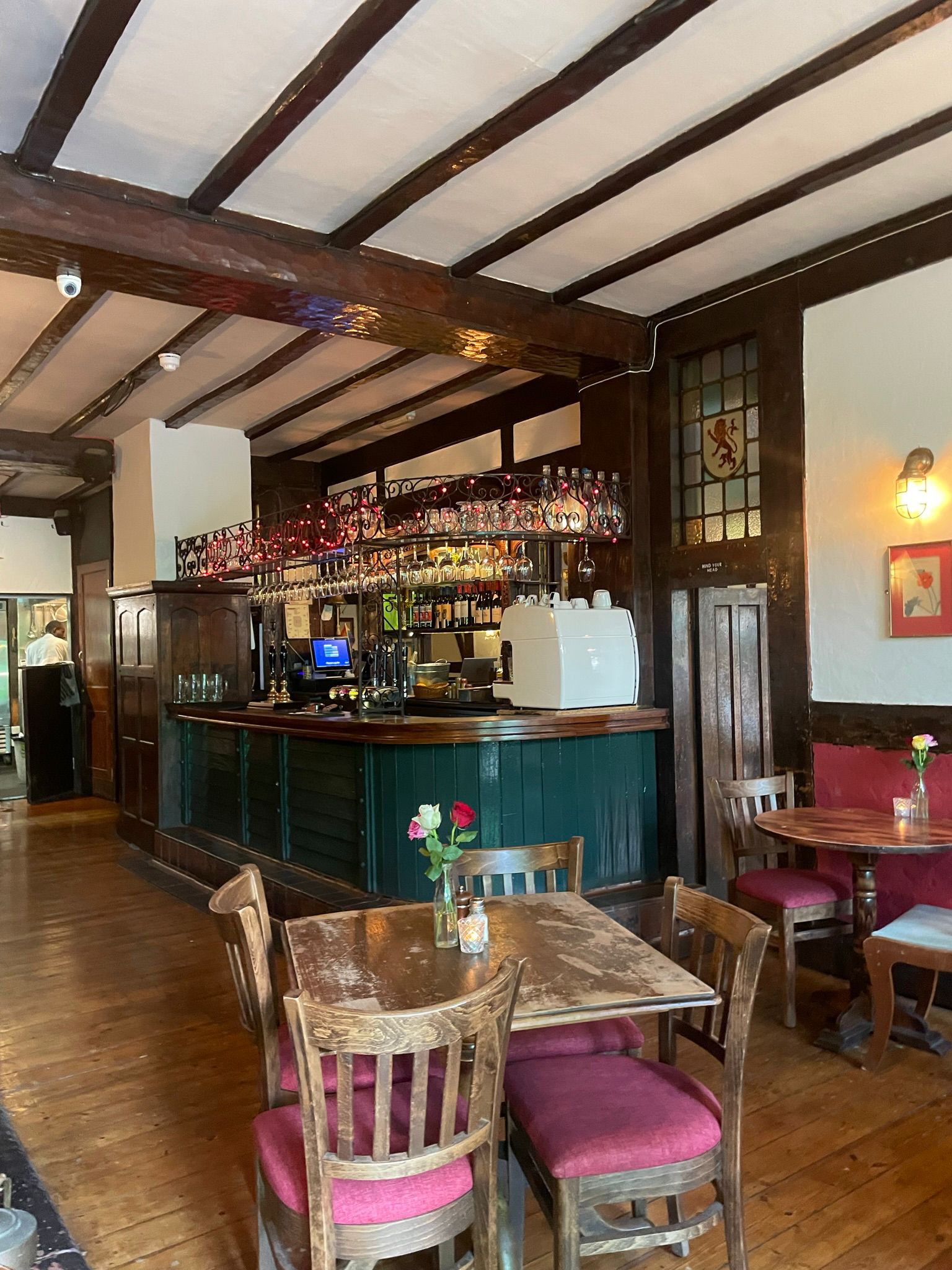 Red Room bar at The Old Red Lion, polished wood counter, ideal for networking events.